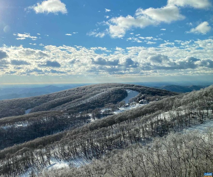 Perched at the highest point along Wintergreen?s view ridge in the heart of Devils Knob Village with breathtaking views of Blackrock Ski Slopes, Blue Ridge Mountains and Rockfish Valley below this beautifully renovated top floor 3 BR is the one you have been waiting for! With soaring cathedral wood ceiling, wall of glass to the panoramic view, floor to ceiling fireplace wall with granite surround and gorgeous new kitchen with granite wraparound bar, the dramatic Great Room will take your breath away! The spacious floor plan with main floor primary en-suite bedroom, guest bedroom, bath and upstairs primary suite with sitting area and oversized bath and dressing area allows for gracious spaces for family and friends. Tastefully updated with new luxury flooring, gorgeous kitchen and baths with handsome Cherry cabinetry, granite counters, lighting, fixtures and appliances there is nothing left for you to do but to enjoy! There is a reason this floor plan and location is so coveted by all who know Wintergreen! Make it your special place at Wintergreen!,Cherry Cabinets,Granite Counter,Fireplace in Great Room