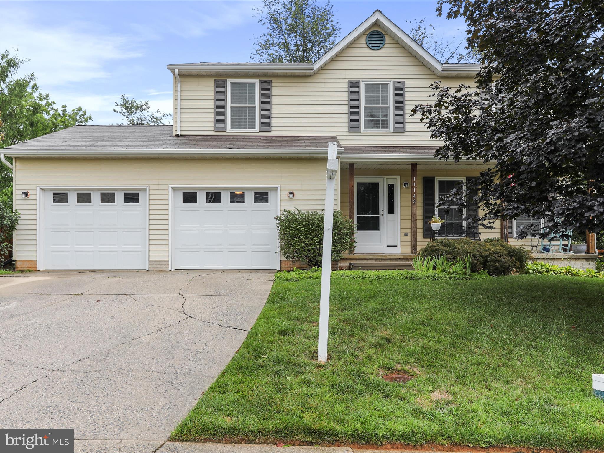 Beautiful front porch colonial with two car garage! Backing to woods adds to the private oasis feel of this very special home! Enter the front door to the foyer, living room to your right, or center hall leads past the half bath to spacious kitchen area. Large kitchen dining area equipped with island has doors out to maintenance free deck facing wooded area! Also, a separate dining room with window overlooking fenced backyard. Four spacious bedrooms upstairs. Primary bedroom has walk in closet and bathroom. Lots of storage space. Downstairs is a finished family room with lots of space for games and relaxation! Fantastic location, near schools and shopping!