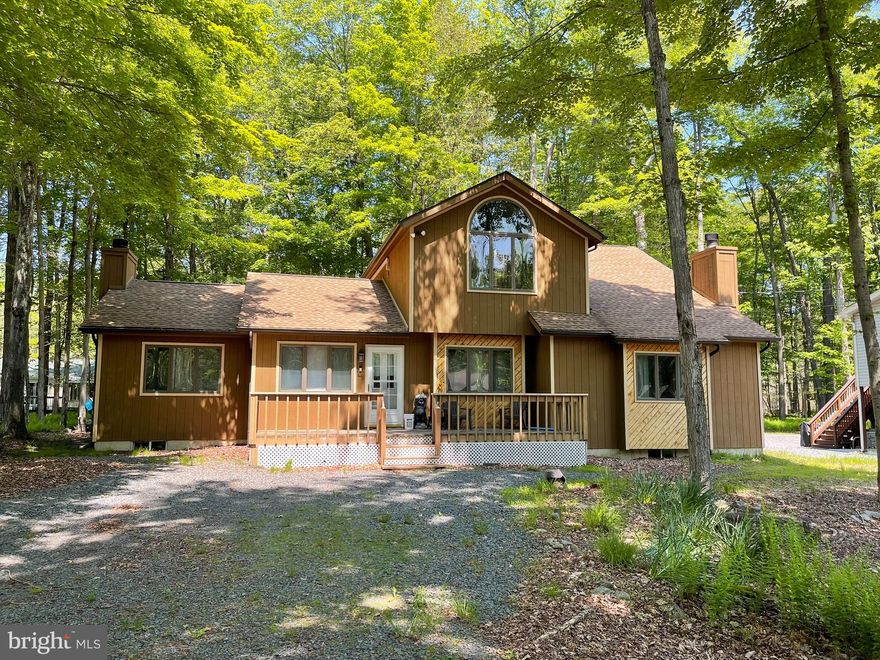 Get ready for summer  in the Poconos and Arrowhead Lake and snap up this this 4 bedroom/2bath mountain modern retreat, whether for investment or personal use! Discover your dream mountain getaway in this contemporary 4-bedroom, 2-bathroom home, nestled in the gold star gated community of Arrowhead Lake. Enjoy an open-concept living area with a 2 cozy fireplaces and abundant natural light, a spacious kitchen and dining area perfect for entertaining, and a versatile bonus room for extra seating or a home office. With generous bedrooms, two fireplaces for winter warmth, and air conditioning for summer comfort, this home has it all. The community features 2 PRISTINE LAKES, 3 POOLS, 4 SANDY BEACHES, plus endless recreational activities like boating, fishing, and hiking. Just 2 hours from Philadelphia and New York, this property is ideal as a family retreat or a short-term rental investment. Booking for summer and this income can be in place for the new owner. Don't miss this opportunity to own your mountain escape in the heart of the Poconos!