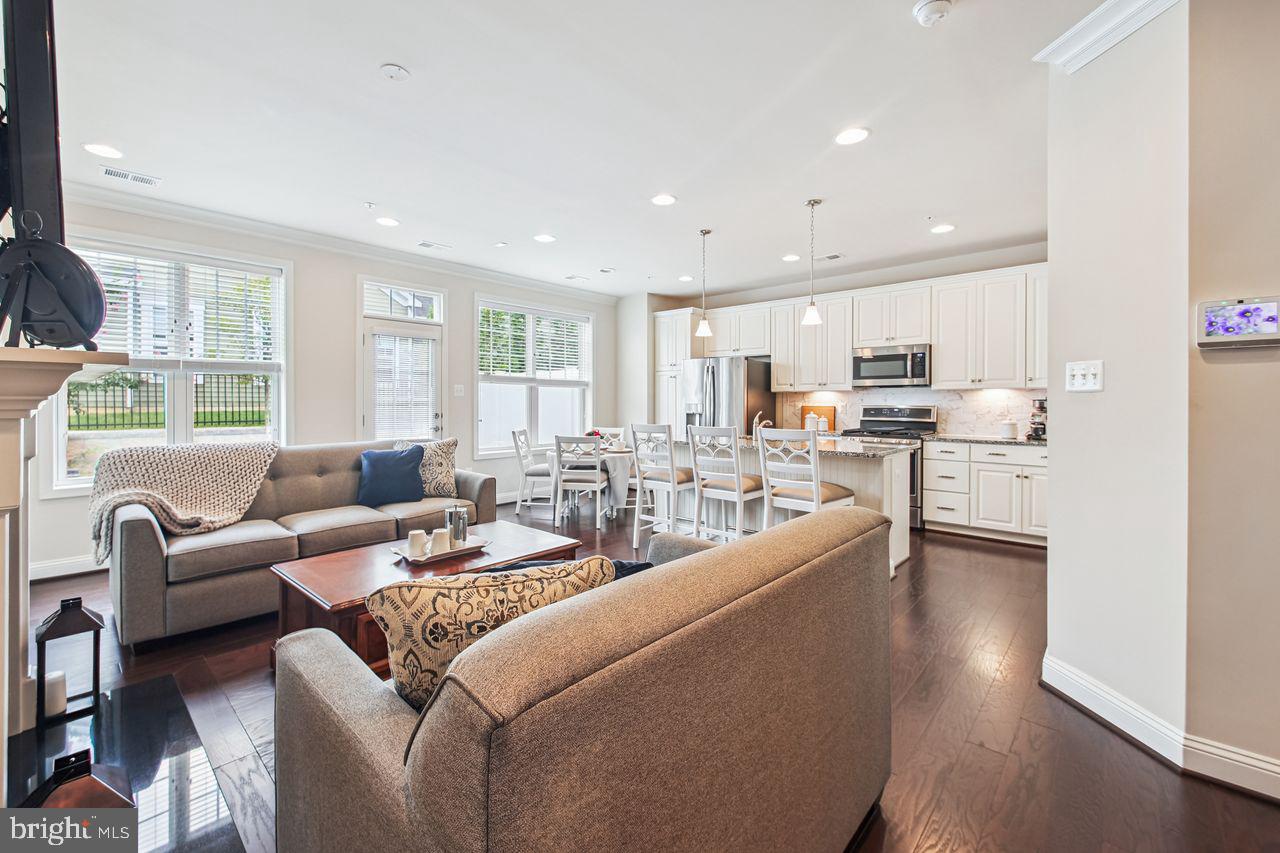 Welcome to 1455 Catbriar Way, a beautifully maintained Baldwin model villa in the highly sought-after Regency-Two Rivers 55+ community. Built by Classic Group, LLC, this 2-story attached home offers comfort, functionality, and access to resort-style amenities. The main level features a welcoming foyer with access to a 1-car garage, laundry area, and half bath. The spacious primary suite includes a walk-in closet and full bath for convenient main-level living. Enjoy cooking and entertaining in the open eat-in kitchen, complete with stainless steel appliances, white cabinetry, and granite countertops. The adjacent living room features a cozy fireplace and opens to a private patio and small grassy area—perfect for relaxing outdoors.
Upstairs, you'll find a versatile loft with built-in shelving, a second bedroom with a large walk-in closet, and a full bath—ideal for guests or a home office setup. Additional highlights include 9-foot ceilings throughout, creating a bright and open feel.
As a resident of Two Rivers, you'll enjoy access to a premier clubhouse, indoor and outdoor pools, fitness and yoga studios, game and ballrooms, a culinary center with demonstration kitchen, tennis and pickleball courts, and a dog park. Don’t miss this opportunity to live in one of Odenton’s most desirable active adult communities!