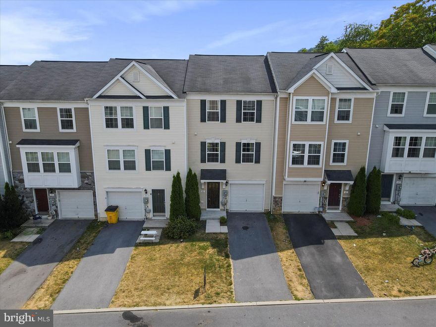 Welcome to this stunning 3-level townhome located in the desirable Stonebrook Village subdivision of Hedgesville. This charming residence features 3 spacious bedrooms and 2.5 baths, perfect for comfortable living. The home boasts modern LVP flooring throughout majority of home, providing both style and durability. The partially finished basement offers ample space for storage or potential for additional living areas, and includes a rough-in for a second half bath. The fenced backyard is perfect for outdoor gatherings, pets, and family activities. Conveniently situated close to all Hedgesville schools, parks, and the local little league field, this townhome offers both comfort and convenience. Experience the perfect blend of suburban tranquility and easy access to community amenities in this inviting townhome.