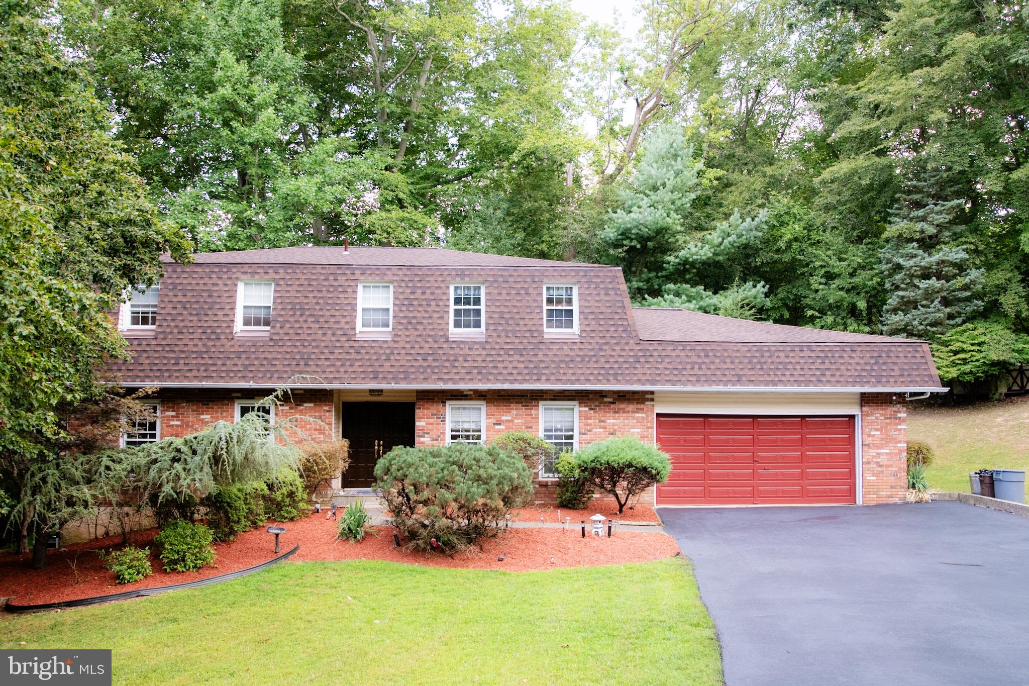Welcome to this beautifully maintained contemporary center hall colonial, perfectly situated on a peaceful corner lot in desirable Marple Township. With 4 bedrooms and 2.5 baths, this home offers the ideal blend of comfort, function, and charm.
Step inside the inviting center hall, where hardwood floors flow into a sunlit formal living room. The dining room sits just off the spacious eat-in kitchen. It's perfect for entertaining and those large holiday dinners. The kitchen features white cabinetry, tile flooring, and sliding glass doors that open to a large deck—perfect for summer gatherings or quiet evenings surrounded by nature. A cozy family room with a fireplace has its own access to the deck creating a seamless connection between indoor and outdoor living.
Upstairs, you’ll find four generously sized bedrooms, including a serene Primary Suite complete with a walk-in closet and private bath. A full hall bath serves the additional bedrooms with ease.
The finished basement adds even more versatile living space—whether for entertaining, a home office, or a playroom. A two-car garage and large first-floor laundry room provide everyday convenience.
Surrounded by mature trees and lush landscaping, this home is ready to be the backdrop for years of wonderful memories. Don’t miss this opportunity to enjoy both space and serenity in one of Marple’s most sought-after neighborhoods! Home has been well maintained by owner. BRAND NEW ROOF AND DRIVEWAY REPAVED IN AUGUST 2025.