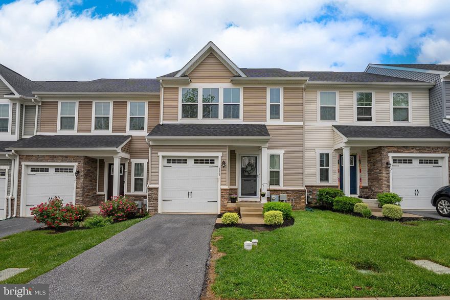 Welcome to this beautifully maintained 3-bedroom, 2.5-bath townhome in the sought-after Malvern Walk community. Just walk into the front door and you are on the main level with the kitchen, living area and powder room.  No steps until you are ready to go to the bedroom level or the finished lower level! This home is in the award winning Great Valley School District and was built in 2018 so it is very modern. The current sellers added extra hi hats for lighting, installed cable and coax in every room, made this a Smart House with a WIFI extender which allows for strong internet access from anywhere in the house and extended the deck upon ownership. Just step inside to discover gleaming hardwood floors that flow throughout the spacious main level from the foyer to the kitchen area. The main level is an open concept with kitchen, family room and powder room as well as inside access to the one-car garage. The upgraded kitchen is a chef’s dream, featuring modern 42” cabinetry, granite countertops, stainless steel GE appliances, ample counter top space and lots of cabinets for storage. The island is a convenient breakfast bar-ideal for both everyday living and entertaining. Egress from the kitchen area is the 12X20 extra large Trex deck with it’s own private stair case to the back yard. The deck was extended and the stairs added post closing by the current sellers and is fully permitted. Enjoy outdoor living on this deck- perfect for summer barbecues or just unwinding from a busy day.The second level boasts three bedrooms, two full baths and the laundry room. The primary suite is carpeted, has a trey ceiling, large size primary bath and two big walk-in closets. Doing laundry is a breeze as it is a big room and on this level. The finished lower level offers versatile space perfect for a family room, home office, or gym. The lower level is already plumbed for a bath so it’s easy to install should one desire. Located in the award-winning Great Valley School District, this home is minutes away from the Paoli train station with easy access to Routes 202 and 30. With thoughtful upgrades throughout and a prime location, this move-in-ready townhome is the perfect place to call home!