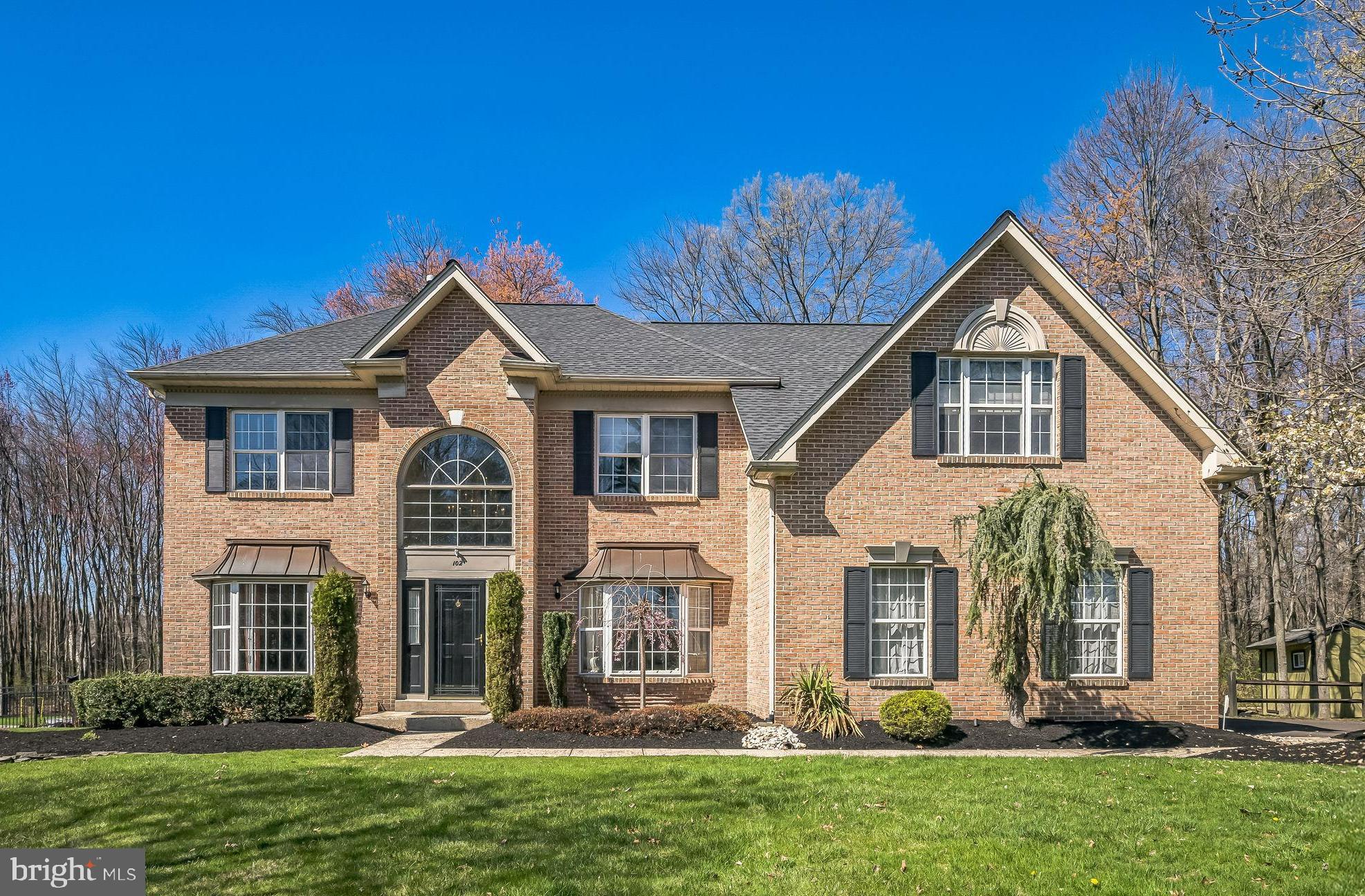 Stunning Brick-Front Colonial on Over an Acre in a Prime Cul-de-Sac Location!
Welcome to your dream home! This beautifully updated 4-bedroom, 2 full and 2 half bath residence is perfectly situated on over an acre of land, offering breathtaking views, exceptional privacy, and a lifestyle of comfort and elegance. From the moment you arrive, the impressive brick façade and quiet cul-de-sac setting set the tone for what awaits inside. Step through the front door into a bright and welcoming two-story foyer with hardwood floors that are flanked by a private office with French doors and a sunny bay window—ideal for working from home. The formal living room with crown molding flows seamlessly into the elegant dining room, which features custom millwork and a double window overlooking the expansive backyard. The heart of the home is the updated eat-in kitchen, boasting an abundance of crisp white cabinetry, an island with breakfast bar, gas 5-burner cooktop, and a sunlit breakfast room with French doors leading to the large patio—perfect for everyday meals and entertaining. The kitchen has beautiful hardwood floors and opens to a spacious family room also with hardwood floors, soaring ceilings with skylight and a show-stopping stone fireplace flanked by custom windows with sunrise transoms, bathing the space in natural light. A back staircase, convenient powder room, and large laundry/mudroom with access to the oversized 2.5-car garage complete the main level. Upstairs, you'll find four generously sized bedrooms. The luxurious primary suite is a true retreat with wood flooring, a vaulted ceiling, sitting room also with a vaulted ceiling (ideal as a second office or dressing room), two walk-in closets, and a brand-new spa-like bath featuring a gorgeous tile floor, double vanity, oversized stall shower, and a freestanding soaking tub. The hall bath has also been recently renovated with double sinks, beautiful tile, and a tub/shower combo. A hallway pull-down attic offers additional storage. The fully finished basement is an entertainer’s paradise with a game room featuring a wet bar with built-in refrigerator and freezer, a media room with surround sound and built-ins, a playroom with storage closets, a powder room, and a fantastic home gym. Step outside to your own private oasis—this level backyard is ideal for barbecues, playing ball, a swing set, and more. The flagstone patio and stone wall for the perfect spot for entertaining and dining alfresco. A storage shed provides space for your gardening tools and snow blower, keeping your garage clutter-free. Tucked in a prime location just minutes from top-rated schools, shopping, dining, walking/biking trails, and township parks. Doylestown and major commuting routes including the PA Turnpike and Route 202 are just a short drive away. This home truly has it all—space, style, privacy, and an unbeatable location. Don't miss this incredible opportunity!