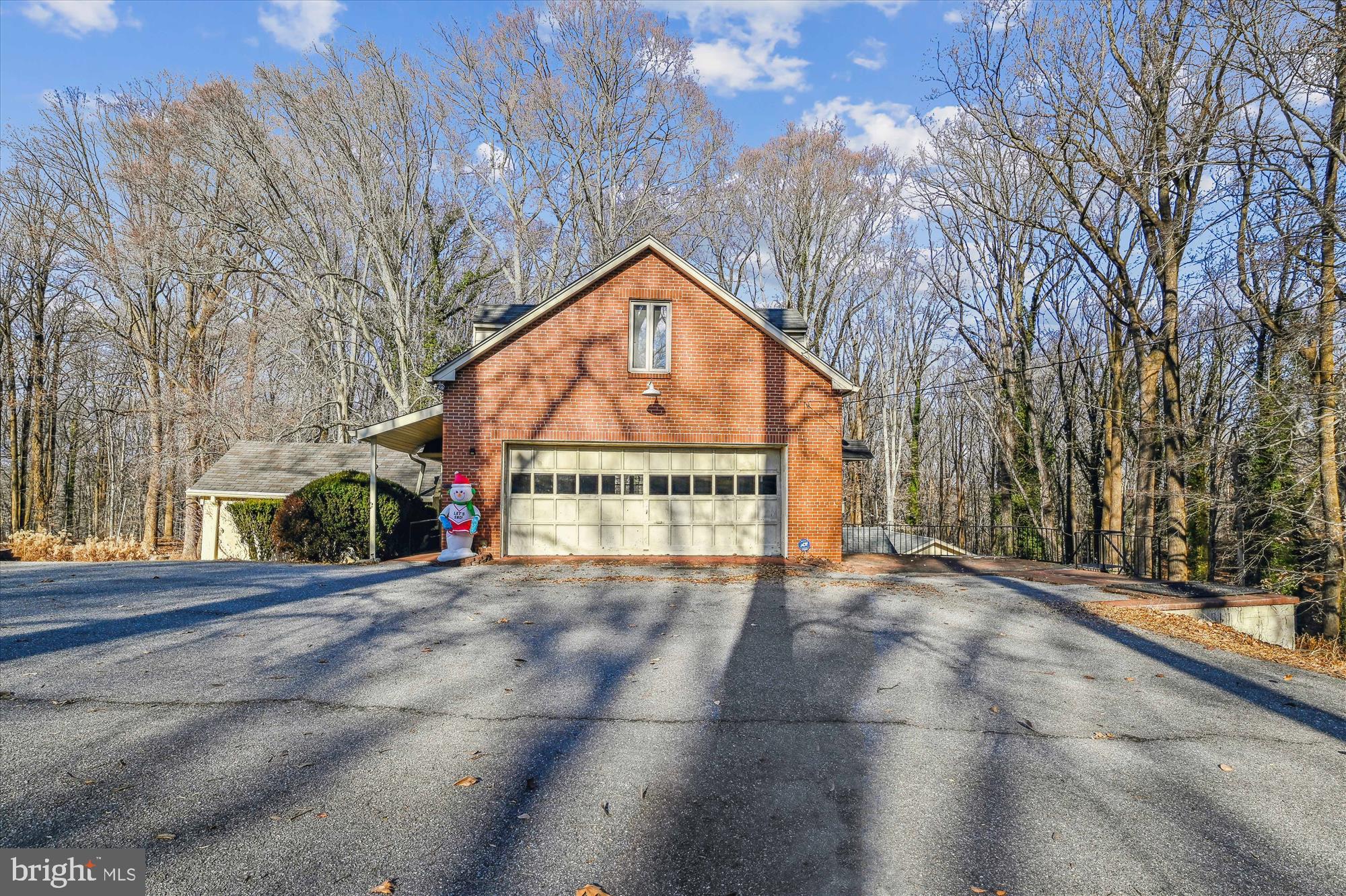 Rare opportunity and one-of-a-kind find best describes this picturesque property consisting of approximately 3 acres backing to and overlooking the vast Patapsco State Park. This storybook setting includes the main stone house (612 Gun Rd) with detached garage, guest house (614 Gun Rd), and large two story garage/workshop with upper level 2 bedroom apartment (616 Gun Rd) Please see Bright MLS listing #MDBC2115920 for 614 Gun Road. This property is being offered for sale in conjunction with listing for 614 Gun Road. Total list price of $1,295,000.00 includes all 3 dwellings known as 612, 614 & 616 Gun road. Quality custom built property with old world charm, character and craftsmanship. Wood foors, detailed woodwork trim, panels and exposed beams. Unlimited possibilities...don't miss the opportunity to see this unique property.