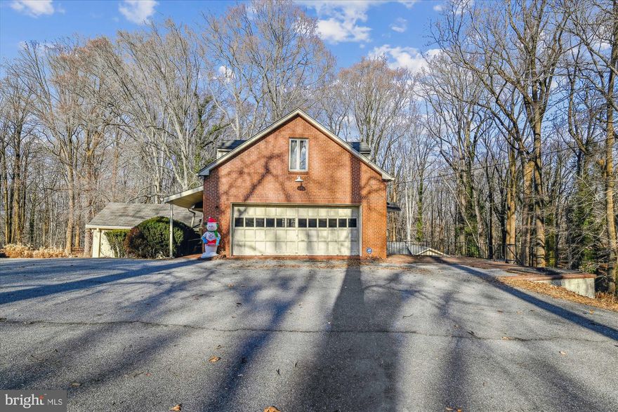 Rare opportunity and one-of-a-kind find best describes this picturesque property consisting of approximately 3 acres backing to and overlooking the vast Patapsco State Park. This storybook setting includes the main stone house (612 Gun Rd) with detached garage, guest house (614 Gun Rd), and large two story garage/workshop with upper level 2 bedroom apartment (616 Gun Rd) Please see Bright MLS listing #MDBC2115920 for 614 Gun Road.  This property is being offered for sale in conjunction with listing for 614 Gun Road. Total list price  of $1,295,000.00 includes all 3 dwellings known as 612, 614 & 616 Gun road.  Quality custom built property with old world charm, character and craftsmanship. Wood foors, detailed woodwork trim, panels and exposed beams. Unlimited possibilities...don't miss the opportunity to see this unique property.  Sold Price is joint/simultaneous sale of both 614 & 616 Gun Rd.