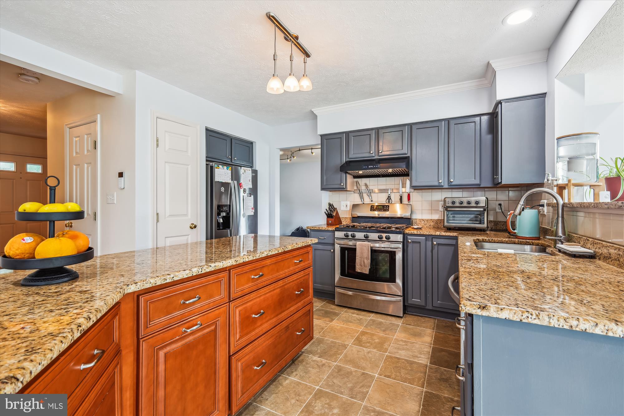 Major Price Improvement! Welcome to 103 Banbridge Avenue, where comfort meets style in this beautifully maintained 4-bedroom Colonial, the epitome of comfort and luxury! Nestled in the sought-after North Brook neighborhood, with NO HOA, this stunning property boasts numerous captivating features that are the perfect mix of modern upgrades and classic charm. Ideally located for an easy commute to Annapolis / Easton / or Dover! Step inside to an open floor plan that creates a smooth flow from room to room. It's a great setup for entertaining guests or enjoying everyday life with family and friends. The living room and family room are both bright and spacious, with large windows that fill the home with natural light and warmth. The spacious kitchen is a cook's delight, showcasing beautiful granite countertops that add elegance to the space. Prepare meals effortlessly while enjoying the company of loved ones in the adjacent Sun Room, where panoramic views of the lush backyard create a serene atmosphere, making it an ideal spot to relax or enjoy a meal. Upstairs, the owner’s suite is a private retreat with a spa-like bathroom that includes a tiled shower with glass doors, a double-sink vanity with granite, and a calming atmosphere to unwind after a long day. Three additional bedrooms and a full hallway bath with a shower and tub combo offer comfort and flexibility for family or guests. Storage will never be an issue as the home offers tons of storage space, ensuring you can keep your belongings organized and out of sight. The finished basement adds even more living space that’s perfect for a home theater, gym, or playroom, and its own Laundry area. Step outside to your personal backyard escape. The large deck and stamped concrete patio provide the perfect setting for outdoor dining and entertaining. The fully fenced rear yard features a basketball court and ample space for play, gardening, or simply enjoying the outdoors. The spacious two-car garage has a wire drop installed for charging an electric vehicle. This home is move-in ready and packed with value. It offers a lifestyle of comfort, convenience, and room to grow. Don’t miss your chance to make it yours. Schedule your showing today and get ready to fall in love!