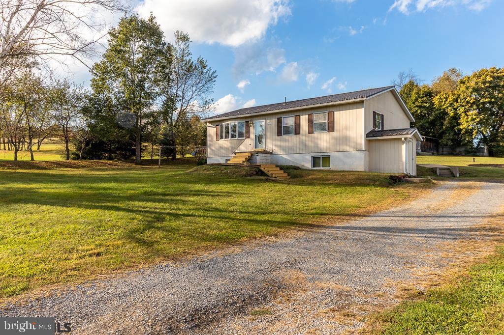 View virtual tour: https://youtu.be/SGQuTck_tI0. Wonderful opportunity to own a nicely maintained ranch home on nearly one acre and less than a five minute walk to Colyer Lake. A cozy living room, eat in kitchen, and three bedrooms on the main level make this inviting home great for a first time buyer or an established home owner looking for a place by the lake. Large rec room downstairs in the partially finished basement great for entertaining or hobbies. Plenty of storage in the unfinished part of the basement. Covered back porch and large side deck adorn the outside as you enjoy the tranquility of living near Colyer. Storage barn with electricity and sliding doors provide shelter for all the yards tools you'll need to care for this serene three quarter of an acre lot, or your kayaks/boats and any other lake equipment you can enjoy! Peace and quiet by the lake...schedule a showing and it can be yours!!