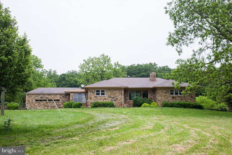 PRICE DROP BRING ALL OFFERS!! Well built stone home w/ hard wood floors throughout.  Home flows nicely w/ casual wide open spaces filled with light.  Tranquil setting w/ pond surrounded by extensive landscaping, stone run-in shed & very private yard with great views.  Two car garage & plenty of room in the basement to spread out w/ family and friends.  Opportunity abounds in this cozy rambler