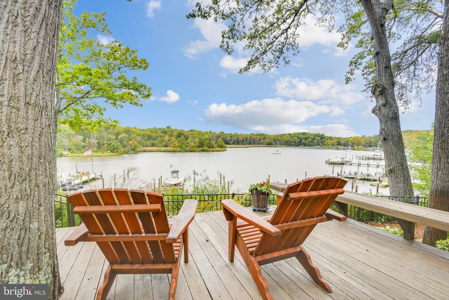 Amazing big water views from this well maintained home nestled in a private setting in the Edgewater community of Holly Hill Harbor. Enjoy beautiful sunsets year round from almost every room in the home or from one of multiple outdoor entertaining areas. From the moment you walk in you will be drawn to the views through the wall of doors and windows, yet feel the privacy that surrounds you. The open floor plan with a well thought out use of space sets this home apart from all the others. Outdoor entertaining is made easy with the use of multiple decks, patios, hot tub and a firepit. The updated pier allows for many options: 
canoe/kayak launching, a boat lift and a boat slip. Located on a protected deep water creek and within close proximity to major waterways for water sports and direct access to the Chesapeake Bay .