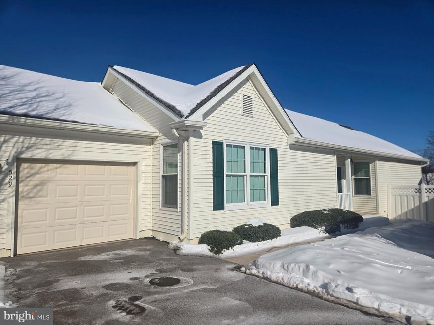 Welcome to 529 Fox Den Court, a beautifully maintained home nestled on a quiet cul-de-sac in the highly sought-after Fox Hill Farm community of Concord Township.

The main level features a bright, open layout with Anderson windows throughout that has been freshly painted and offers brand new carpet and luxury vinyl plank flooring. There is a spacious living with a double-sided gas fireplace—perfect for both everyday living and entertaining. The kitchen offers ample cabinetry and counter space, a center island, and seamless flow into the dining area, creating a warm and welcoming gathering space. Sliding doors lead to the no-maintenance rear deck, ideal for relaxing or enjoying the peaceful surroundings.

The primary bedroom offers generous closet space and a private bathroom featuring a walk-in shower and soaking tub. An additional well-sized bedroom shares a full hall bath with a tub/shower combination, providing flexibility for guests or a home office. A laundry room with access to the attached one-car garage finishes off the main floor of the home.

The expansive unfinished basement is filled with natural light and offers walk-out access to a tranquil, wooded setting with direct access to the community walking trail. This space provides abundant storage and endless potential for additional living space, whether you envision a recreation room, home gym, or hobby area.

Conveniently located near shopping, dining, and major roadways—and offering a beautiful clubhouse along with numerous community amenities—this home combines privacy, accessibility, and low-maintenance living. A wonderful opportunity to enjoy life in one of Glen Mills’ most desirable 55+ communities.