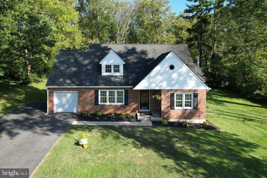 TONS OF UPDATES:  Refinished Hw floors on main level, New carpet upstairs, Remodeled main floor BA, Drylocked basement walls and floors, New kitchen island with Quartz, Painted white cabinets, New Stove, Dishwasher, Range hood, Updated electrical, new light fixtures, New Garage door and springs, and Fresh paint through out.  Come move right in!