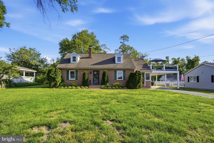 Welcome to coastal charm at its finest. This beautifully updated 3-bedroom, 2-bath Cape Cod offers 1,680 square feet of thoughtfully designed living space in the heart of Rock Hall. Built with solid brick construction, this home seamlessly blends timeless character with modern upgrades.

The main level features a stylishly updated kitchen with stainless steel appliances, warm hardwood floors, and a cozy living room centered around a wood-burning fireplace. A first-floor bedroom and full bath provide flexible living options, while the updated laundry room adds everyday convenience. Step outside to the screened-in porch—perfect for unwinding after a day on the water.

Upstairs, two spacious bedrooms and a full bath are complemented by access to a private second-story deck, where you can take in serene water views of Rock Hall Harbor. Complete with your own hot tub, this outdoor space is designed for relaxation and entertaining.

Ideally situated within walking distance to marinas, waterfront dining, shops, and all that Rock Hall has to offer, this home is the perfect full-time residence, weekend escape, or investment opportunity.
