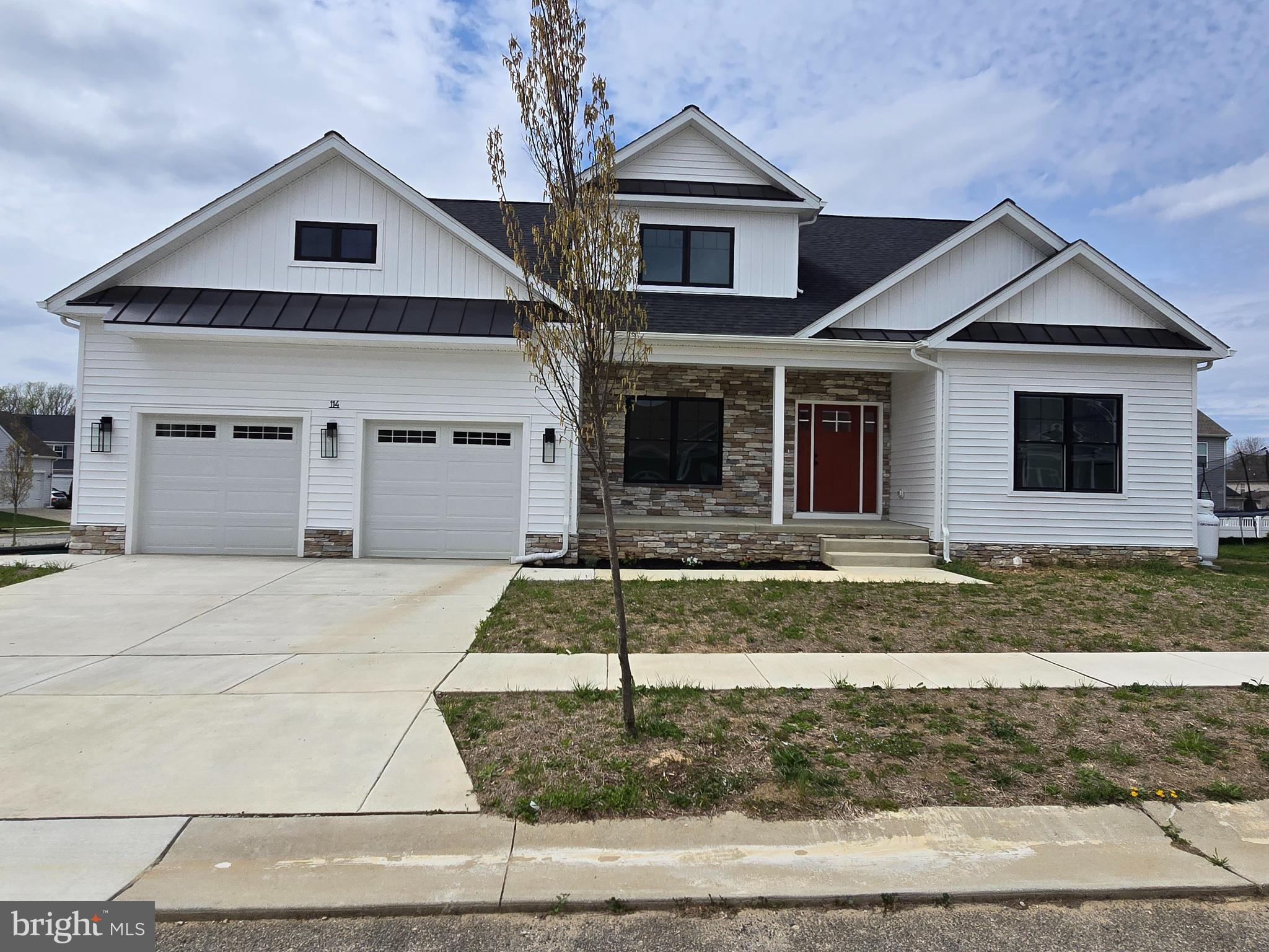 Price improvement with immediate occupancy! No need to wait for new construction, this one is ready for you today! This modern home is coming with every popular upgrade on your wish list. This amazing floor plan features a first level owner's suite, with a huge walk-in closet, custom tiled shower, two huge, secondary bedrooms and full bath on the second level. The living space is so welcoming with the great room off the kitchen and dining area. The dining area boosts an over-sized 8'x8' slider. The great room has 10' ceilings in the tray, fireplace, and patio entrance to your own covered porch. There is also a private study perfect to work from home, enjoy a good book, or just a second living area. The kitchen features beautiful solid wood white shaker cabinets to the ceiling, quartz tops, sleek, matte black, gourmet appliances, large island, massive pantry, plus a big laundry room with matching cabinetry and quartz. Also, a great little nook in the mudroom, use as a desk, drop zone, recycling center, or whatever you prefer. Gorgeous lighting package, over-sized garage, full unfinished basement, LVP flooring throughout the living area, oh and let's not forget the curb appeal! Black vinyl windows, board and batten siding, concrete driveway, professional color scheme. This one is a showstopper. Not to mention the LOCATION! Last lot in Providence Farms community, located 2 blocks from the new YMCA, with-in walking distance to downtown Centreville to enjoy the shops and dining options. Grocery shopping right up the street, also minutes to 301 for the work commute. Builder warranty provided.