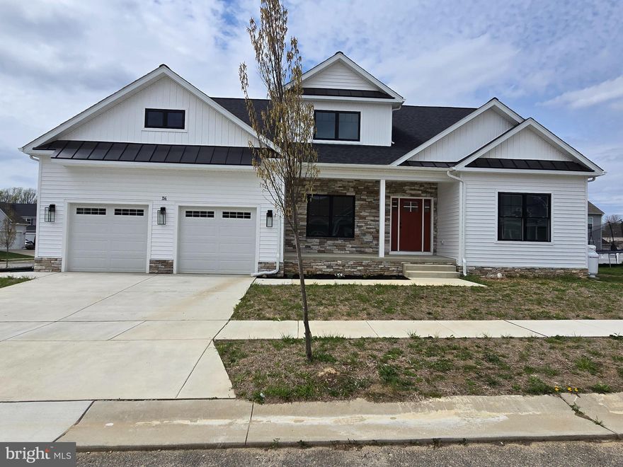 Price improvement with immediate occupancy!  No need to wait for new construction, this one is ready for you today!   This modern home is coming with every popular upgrade on your wish list.  This amazing floor plan features a first level owner's suite, with a huge walk-in closet, custom tiled shower, two huge, secondary bedrooms and full bath on the second level.  The living space is so welcoming with the great room off the kitchen and dining area.  The dining area boosts an over-sized 8'x8' slider.  The great room has 10' ceilings in the tray, fireplace, and patio entrance to your own covered porch.  There is also a private study perfect to work from home, enjoy a good book, or just a second living area.  The kitchen features beautiful solid wood white shaker cabinets to the ceiling, quartz tops, sleek, matte black, gourmet appliances, large island, massive pantry, plus a big laundry room with matching cabinetry and quartz.  Also, a great little nook in the mudroom, use as a desk, drop zone, recycling center, or whatever you prefer.  Gorgeous lighting package, over-sized garage, full unfinished basement, LVP flooring throughout the living area, oh and let's not forget the curb appeal!  Black vinyl windows, board and batten siding, concrete driveway, professional color scheme.  This one is a showstopper.  Not to mention the LOCATION!  Last lot in Providence Farms community, located 2 blocks from the new YMCA, with-in walking distance to downtown Centreville to enjoy the shops and dining options.  Grocery shopping right up the street, also minutes to 301 for the work commute.  Live in town with the community feel without HOA fees!  Builder warranty provided.