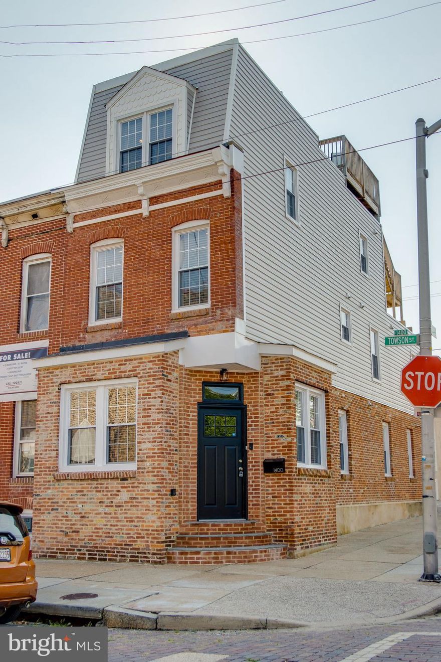 This completely renovated end-of-group row home is Locust Point living at its finest! With 3 finished above grade levels, this home is flooded with gorgeous natural light. Exposed brick and edgy black cabinets mix with countless upgrades from a 2019 renovation to create a sophisticated and sleek Baltimore charm. This row home boasts 3 bedrooms, including one with its own private balcony and a master bedroom featuring 2 walk-in closets and a stunning master bath. 2nd-floor laundry adds extra convenience to this thoughtfully modernized property. Entertain guests in the gourmet kitchen complete with a gorgeous island and enjoy fresh air and panoramic city views from the rooftop deck. On top of everything, this home also boasts its own parking pad, adding to the convenience of city living. There's nothing to do but move in!