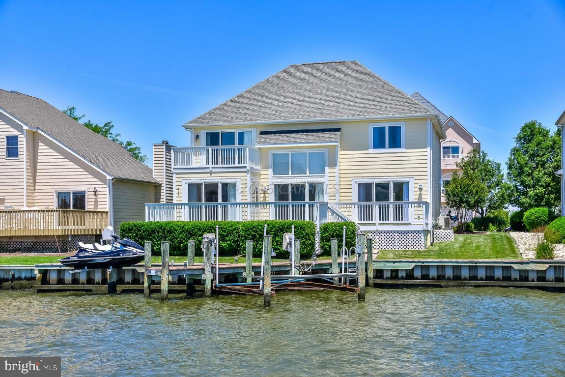 Step inside this custom waterfront home in North OC and be greeted by water views throughout,cathedral ceilings w/ many windows maximizing natural light,2 living areas w/ shared wood burning fireplace,open-concept floor plan w/ flowing tile floors,spacious kitchen w/ pantry,bountiful counter space,dining area,and morning room,expansive deck overlooking the canal perfect for relaxing and entertaining,boat lift and jet ski lift,views of the open bay,master suite w/ a private balcony,walk-in closet,and spacious bath w/ separate shower and soaking tub,and 2 additional bedrooms w/ fantastic water views.The home has recently been painted and is offered w/ a $5000 flooring allowance.All of this in desirable Heron Harbour Isle,boasting pool,tennis,and clubhouse within easy distance to the beach.