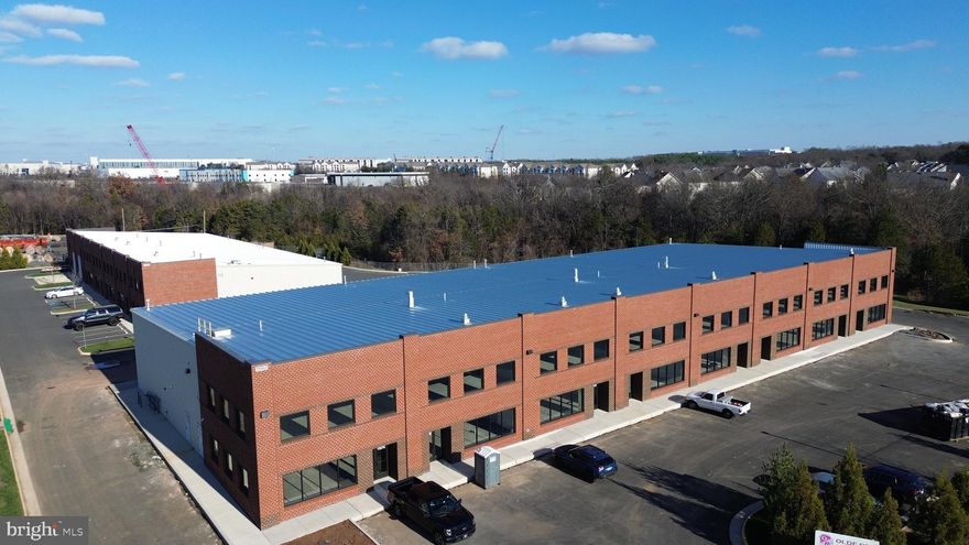 Building complete and ready for immediate occupancy.  7,832 SF warehouse unit for lease in Manassas.  Bay #1 includes two 14'x14' drive in doors and two shared loading docks. Up to 32,012 SF available and sub-dividable down to 4030 SF bays (3,031 SF warehouse with 999 SF mezzanine). 
Electrical: 1600 Amps of 3 Phase power servicing the building. 200 amps of 3 phase power serves each 4000 SF bay. Service can be increased. 
Gas: Natural Gas available via Washington Gas
Fiber Optic internet is available.
Parking: Each 4000 SF Bay comes with 7 parking spaces 
Zoned M-2 in Prince William County and located off Wellington Road near Jiffy Lube Live.