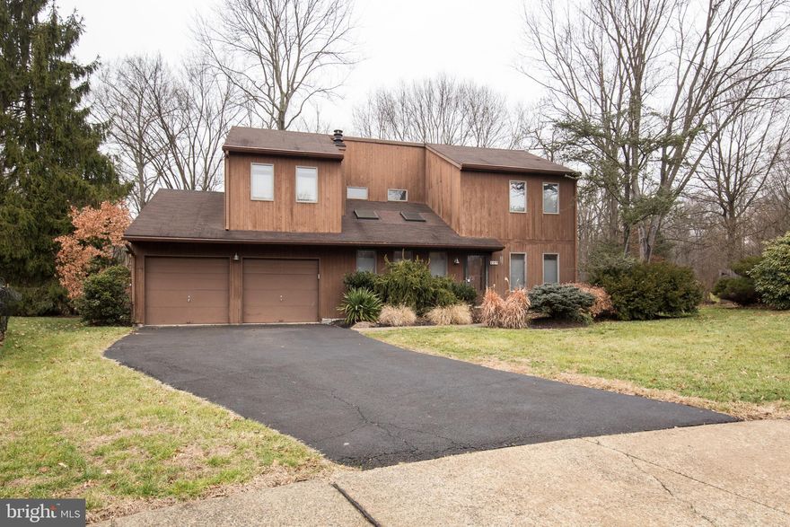 Fantastic opportunity to own a 4-bed, 3-bath home on a quiet cul de sac in the coveted Fairwood community.  Recently updated and expanded with almost 2500 SF of living space this home has an amazing custom kitchen and huge family room that overlooks the fenced yard, woods and protected township land.  Enter the large driveway with 2-car garage and proceed to the front door into the open living room with soaring 2-story ceilings and skylights that offer tons of natural light.  To your right is a large dining room with hardwood floors ideal for family gatherings and holiday dinners.  In the rear you will find a newly renovated chefs kitchen with quartz counters, a full island, stainless appliances with double oven, wine fridge, range hood and huge pantry.  This kitchen is an absolute must-see and is the star of the home.  Past the kitchen is a great flex space that leads direct to the laundry room and garage or to the newly added family room.  This versatile room is ideal for a home office, sitting area, gym or even a yoga sanctuary.  The grand family room has tile floors, vaulted ceilings, skylights, recessed lighting and picturesque views of the yard and rear woods.  The family room includes a new contemporary full bath with stall shower as well as access to a new mud room with double closet that leads back to the laundry room or out to the side of the property.  Upstairs you will find 4 large bedrooms each with ample closet space and 2 full baths.  The master suite has a walk-in closet and a renovated private bath with stall shower and plenty of storage.  The 3 additional bedrooms have plenty of storage space, ceiling fans and access to an updated hall bath with tub and tile surround.  Outside there is a large tiered deck that can be accessed from the kitchen or through a sliding door in the family room.  Your family will enjoy the huge fenced yard with wonderful views of the adjacent woods, walking trail & occasional deer.  Not to be missed, this is a tremendous opportunity for a rarely available home with phenomenal upgrades located at the end of a quiet cul de sac.  HGTV-worthy kitchen, expanded family room, 3 full baths, 2 car garage, huge deck and yard overlooking tranquil preserved land, mud room and tons of additional attic storage space.  Central Bucks schools and easy access to Doylestown, Montgomeryville and Peace Valley Park.  Schedule your showing today, will not last!