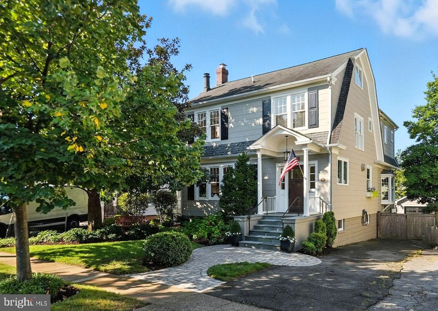 **Offer Deadline Monday, September 15th, at 1pm** Perfectly positioned on a tree-lined street in sought-after Lyon Village, this exquisite 1934 residence captures the timeless charm of Nantucket while blending modern comfort and sophistication. A romantic magnolia tree, solid wood entry door, and welcoming foyer set the tone upon arrival. Original French doors open to a formal living room with an inviting fireplace and custom built-ins.>>>The elegant dining room features a designer light fixture, grass cloth wallpaper, and custom glass cabinetry crafted by a former White House cabinetmaker. A handsome library with built-ins and a cozy bench seat provides a quiet retreat.>>>The home flows seamlessly into an expansive family room with 10-foot coffered ceilings, custom shelving, and a wall of windows that bathe the space in natural light. A casual dining area with a striking oversized light fixture connects to the updated kitchen, complete with a marble island, quartz counters, white cabinetry, dual sinks, beverage drawers, and premium stainless appliances.>>>Upstairs, the primary suite boasts soaring a cathedral ceiling, two closets, and a spa-like bath with marble tile and heated floors. Additional spacious bedrooms and a hall bath with a double vanity accommodate family and guests. A versatile loft level offers an office and space for a bedroom or playroom.>>>The newly renovated walkout basement includes a recreation room with a beverage station, bright bedroom, full bath, and laundry area, providing abundant flexible living space.>>>Outdoor living is equally impressive with a custom-designed covered Ipe deck featuring a built-in grill, a flagstone patio, fenced yard, and mature landscaping with irrigation system—perfect for entertaining. A one-car garage completes this exceptional property.