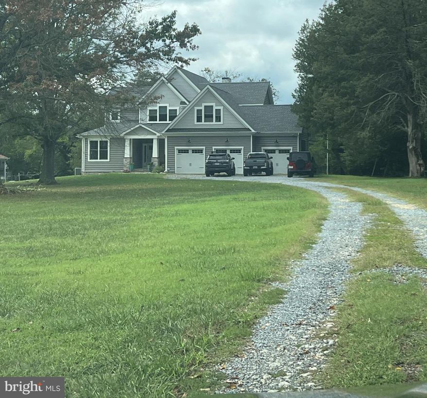 Fantastic waterfront on Back Creek with newer coastal home design on full basement with oversized 3 car garage. The private pier is highly prized with multiple slips, multiple lifts, 60 AMP service nearby! Deep, protected sailboat water is extremely valuable with access to Solomons harbor, the Patuxent River, Chesapeake Bay.  The outdoor living spaces include a screened room with fireplace and water views, large covered porch, screened porch with hot tub for the primary suite. The interior has LVP flooring , high ceilings, high quality Jeld Wen windows and doors. Main level living with a 2 story family room, main level owner's suite with custom bathroom, also a main level guest room or office. You will love the spectacular kitchen with custom cabinetry, Cambria countertops, large pantry, gas cooking and beautiful tile backsplash throughout. Upper level includes 4 bedrooms and a very large bathroom with custom features, double vanity and beautiful custom tile work.  Lower level is unfinished, ready for your imagination!