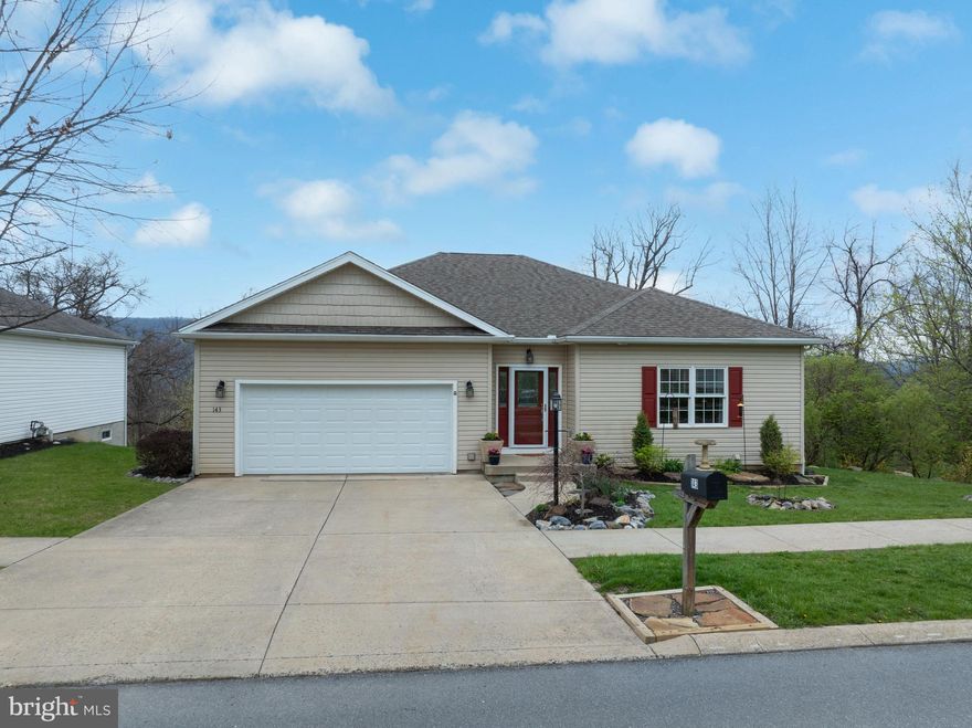 Open House: Thursday, May 7th from 4:30 PM - 5:30 PM.  Experience true one‑floor living at 143 Jonathan Lane, offering 3 bedrooms, 3 baths, and loads of charm. Step inside to the wide foyer, with refinished hardwood floors running throughout the main floor. Glass‑pane French doors open to a generous bedroom or flexible space for an office or family room. The living room features a vaulted ceiling and gas fireplace, adding warmth and airiness. The living room, dining area, and kitchen connect seamlessly, creating an easy flow for everyday living and hosting. The kitchen includes a gas range, island seating, and sliders to the upper deck overlooking the wooded backyard. The full bath is dually accessible to the main living area and a sizeable bedroom. The spacious primary suite sits at the end of the hall with its own private bath. A main‑floor laundry room adds convenience. The walk‑out lower level expands your living space with a large, finished rec room, wide‑plank LVP flooring, French doors to the lower deck, and a private guest suite complete with kitchenette and ensuite bath. Multiple closets and utility rooms provide thoughtful storage. Don't miss the opportunity to enjoy one-floor living in a quiet neighborhood close to shopping, restaurants, parks, views of Bald Eagle ridge, and easy commute to State College and Penn State! Call for a tour today!