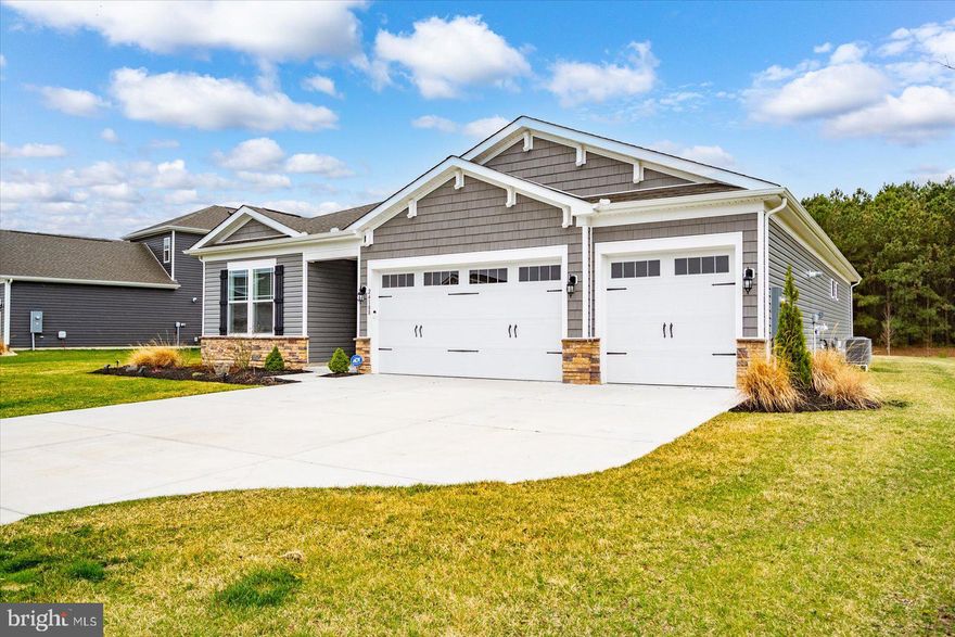 Welcome to your dream home in Woodfield Preserve! This stunning, move-in ready 3-bedroom, 3-bath residence in Milton offers the absolute best in sophisticated single-level living. You’ll fall in love with the spacious, airy open floor plan and high-end upgrades at every turn.

The layout is a total game-changer, featuring TWO  PRIMARY BEDROOMS : a LUXURIOUS PRIMARY SUITE with zero-entry shower and a SECOND PRIMARY BEDROOM with private en-suite bath—plus a bright third bedroom for guests or family! The interior is rounded out by a gourmet kitchen boasting premium finishes, an elegant formal dining room, and a dedicated home office perfect for staying productive.

The "WOW" factor continues with thoughtful enhancements like an epoxied garage floor, keyless entry, and an integrated camera system. Whether you're relaxing in the three-season room with its sleek vinyl windows or heading outside to your professionally hard-scaped backyard oasis—complete with a hot tub, cozy fire pit, and peaceful views of the tree line backing to the Rookery Golf Course—this home is built for entertaining!

Live like you're on vacation with Woodfield Preserve’s incredible resort-style amenities, including a sparkling pool, fitness center, pickleball, dog park, and tot lot. All of this is just minutes from the charm of downtown Milton and a quick drive to Delaware’s premier beaches. Don't miss out on this incredible lifestyle!