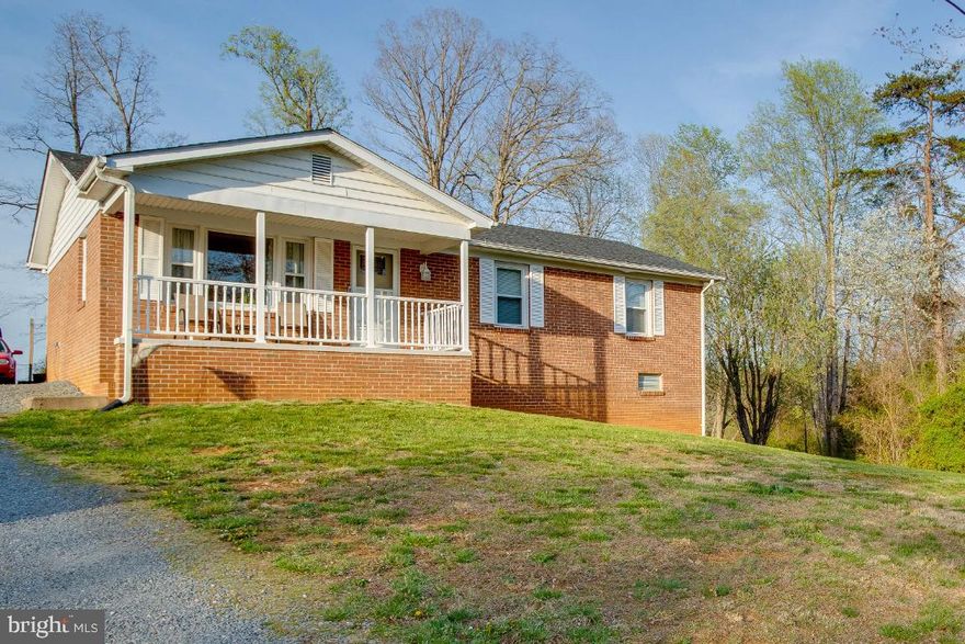 Move-In Ready! Beautiful 3BR/2.5BA One Level brick home situated on a large .77 acre lot. Large living room w/ lots of natural light. Large eat-in country kitchen w/ dining area. Tons of cabinet and counter space. Primary bedroom w/ private full bath. Lower level huge family room w/ tile flooring. Extra room for an office, workout room or whatever you chose. Oversized laundry & storage room. Cozy front porch for relaxing. Oversized concrete patio with hot tub for summer fun enjoying your spacious backyard. Playset and storage shed. Private backyard. Comcast available. Just minutes to Rt 29. House was renovated in 2015 including new roof, windows, doors, bathrooms & kitchen.