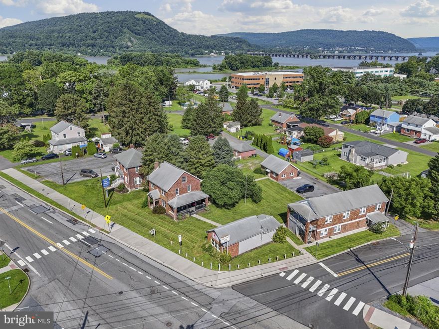 This unique, high-visibility property offers an unbeatable combination of income potential, flexibility, and location—all situated on a single parcel, zoned  Commercial Office Limited. The package includes multiple distinct structures with several revenue streams. A single-story commercial building currently operating as a fully equipped nail and hair salon, a detached two-car garage, six designated parking spaces, a fully leased triplex , and a 2.5-story single-family home. The single-family home has been converted into multiple barber shop and salon suites, ideal for continued commercial tenant use. Alternatively, this space can be easily reverted to its original layout and used as a residence with an attached business—an ideal setup for owner-occupants looking to work and live on-site.

Whether you're an investor seeking a fully occupied, income-producing property, or a business owner looking to combine operations with living space, this property delivers unmatched versatility. Capitalize on the built-in cash flow from the triplex while leveraging the commercial units for your own use or additional rental income.

Seller may consider owner financing for qualified buyers, making this an even more accessible and attractive opportunity.