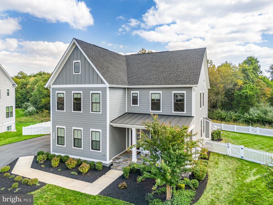 Right now, tucked away in a quiet cul-de-sac in Willowsford, there’s a home that feels like it was designed just for you. It’s an NV home—the Hollins Farmhouse model—and it’s not just any house; it’s truly one of the finest you’ll find. Nestled on a private lot, this property offers all the space you could ever need to create your dream summer oasis. And yes, it even includes a playground set, making it the perfect gathering spot for both kids and adults. The 400 + Sqft four-season covered deck is the cherry on top. 

Step inside with me, and let me show you what makes this home so special. As you walk through the front door, glance to your right. There, you’ll find a dedicated office space. This isn’t just any office—it boasts stunning built-ins and double glass pocket doors, creating a private retreat that is as functional as it is elegant. The attention to detail is remarkable, and you can sense it in every corner. It’s the kind of home that instantly makes you feel at ease.

As we move further inside, the main floor unfolds into an expansive open floor plan. The breakfast/dining area flows seamlessly into the family room and kitchen, creating a warm, connected space perfect for family gatherings. The kitchen is a true showstopper, featuring soft-close custom cabinets thoughtfully selected by the owners—it looks like something straight out of a magazine.

On this level, you’ll also find a main-floor bedroom paired with an absolutely stunning full bathroom—one of the most refined you’ll ever see. Practical features abound, including access to the two-car garage, a mudroom, and a staircase leading to the basement. And don’t miss the breathtaking three-seasons covered porch, which lets you enjoy the outdoors all year round.

Heading downstairs to the basement, you’ll discover even more treasures. There’s a full bathroom, a spacious au-pair or in-law suite filled with natural light from an egress window bay, and ample storage space. This versatile area is ready to adapt to your needs.

Now, let’s head upstairs to the upper level, where you’ll find four bedrooms and three full bathrooms. The primary suite is the crown jewel—a serene retreat complete with two walk-in closets and a spa-like bathroom. Picture dual sinks, a sleek white countertop, a soaking tub, and a walk-in shower. It’s a personal sanctuary designed with relaxation in mind.

Finally, step outside into the backyard, where the magic continues. The playground set promises endless fun, while the beautiful patio invites you to relax or entertain. Best of all, the entire outdoor space is completely private, providing you and your family with a tranquil escape.

Here’s the exciting news: this home will officially go live on February 20, 2025. You can experience its charm in person during the open house on February 22 and 23, from 1–3 PM.

This isn’t just a house—it’s a place where cherished memories are waiting to be made. Could this be the home for you?
This home is located in the award-winning Willowsford Community, framed by the natural splendor of Loudoun's wine country. The resort-style amenities include community events, outdoor beach entry swimming pools, a splash pad, a lodge, a fitness center, a lake, dog parks, tot lots, a sledding hill, and even a tree house! Don't miss the neighborhood farm stand/CSA. This is only a short drive to Brambleton Town Center and One Loudoun dining, shopping, and entertainment. Convenient access to Hal and Berni Hanson Regional Park(257 acres!), local farmer's markets, Wegmans, Dulles International Airport, and the lush Loudoun countryside - bustling with the latest wineries and breweries! Easy commutes to Dulles/Tysons/DC and Silverline METRO—highly sought-after Loudoun County public schools.