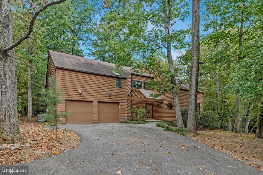 BACK ON MARKET AT IMPROVED PRICE.  Buyer got cold feet.  
Beautiful home in the highly sought-after Reston community, offering the perfect combination of comfort, style, and convenience. Nestled on a quiet cul de sac and backing to mature trees, this residence provides a serene setting with private views that can be enjoyed from the spacious deck. Inside, you are greeted by a bright and open layout designed for both everyday living and entertaining. The home has been freshly painted inside and features NEW carpet on the upper level, refinished hardwood floors on the main level, and new LVP flooring on the lower level. The newly updated kitchen is gorgeous and seamlessly opens to the family room with soaring ceilings. Upstairs, the generous primary suite is a private retreat with a spa-inspired bathroom that includes dual sinks, a separate soaking tub, and a walk-in shower. Additional bedrooms are well-sized with plenty of natural light. An attached garage provides added convenience and storage. Enjoy all that Reston has to offer, including a community pool, walking trails, playgrounds, and easy access to shopping, dining, and commuter routes. This home blends modern amenities with a tranquil setting—don’t miss the opportunity to make it yours!