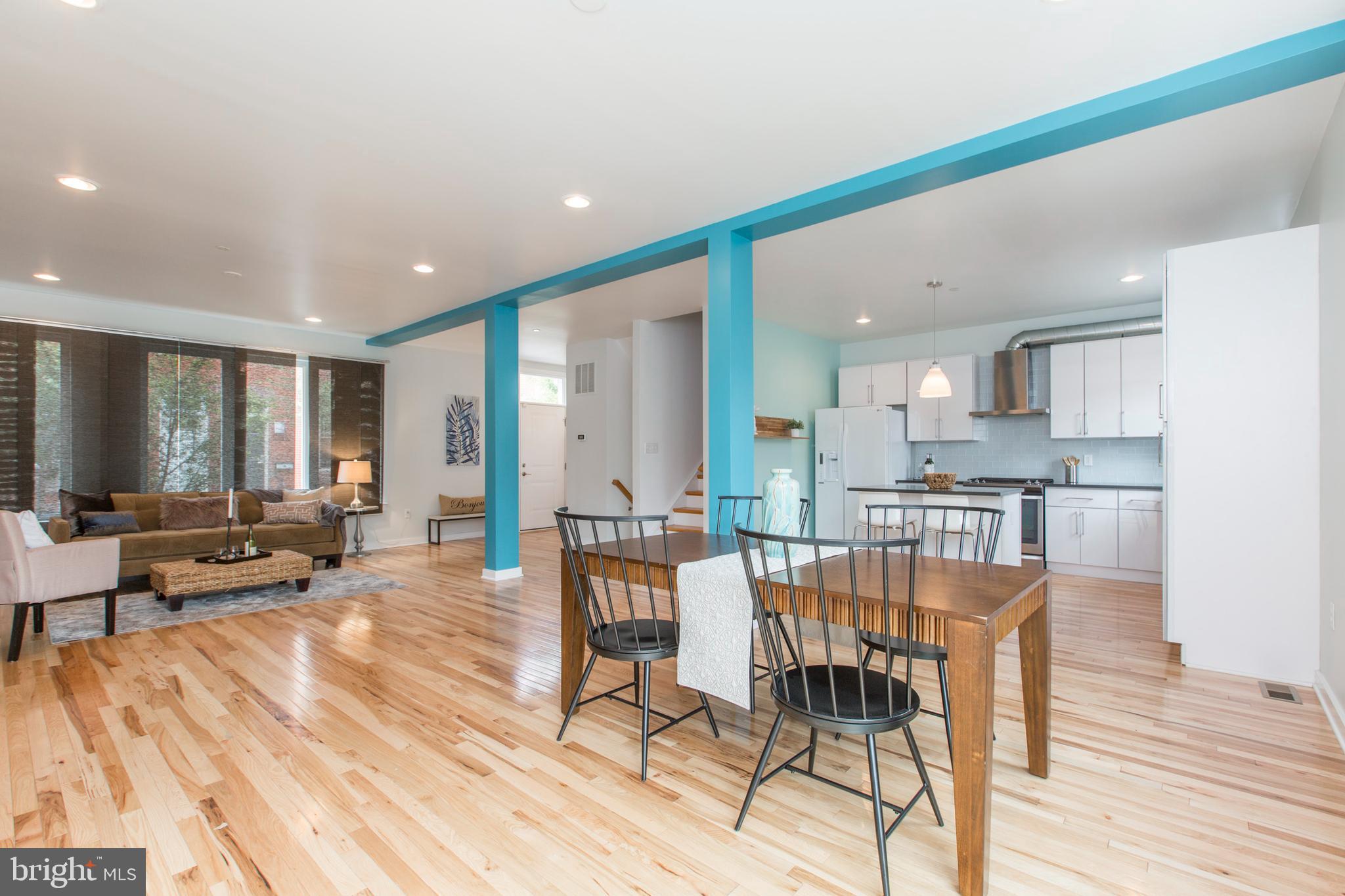 Rare 30' Double wide 4 bedroom - 3 1/2 bathrooms in the heart of the bustling Brewerytown neighborhood. Enter through an open and bright first floor with Southern exposure, featuring Hickory hardwood floors and high hat lightening throughout. Chef's kitchen includes ample quartz countertops & cabinet space. From your dining room area, step outside to your private patio spanning the length of the property line. The 2nd floor features 3 great size bedrooms, washer dryer area and full hallway bathroom. There is also an en suite bathroom in one of the bedrooms. 3rd floor is your primary suite with dual walk-in closets, dual vanity master bathroom and stall shower. Kitchenette area as you head up to the roof deck with amazing views. This home also includes dual zoned heating & cooling and Fios. Easy access to all public transportation.