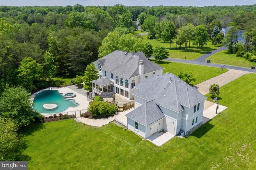 MAKE AN OFFER NOW and be settled in by Thanksgiving! This home is perfect for holiday entertaining! Plenty of room for guest to stay in the 2 bedroom guest house. Stop by and see the refreshing, sparkling oversized heated pool and hottub. And be sure to check out our new flooring and updates! This gorgeous home could be yours! Next Labor Day, you could be entertaining your friends and family here! Set up your grill on the expansive deck located conveniently off the remodeled kitchen and take a refreshing swim in your very own heated pool and hot tub with tons of space to entertain. No need for hotels, your visitors can stay in the tastefully decorated guest house complete with kitchen, fireplace, living area and 2 beds and a full bath. FRESH Paint, new carpet and Flooring! Come see your new home sweet home! This warm and welcoming Stucco and Stone Estate Home located on 5 private acres is  just waiting for memories to be made! COMPLETELY RENOVATED IN 2008-2011, the graciously appointed interior with built ins galore. From the tastefully decorated interior to the 1300 sf pool/hot tub area, this home is perfect for entertaining.  Enter through the large open foyer by the grand staircase or through the family oriented mudroom complete with built in cubbies for bookbags and boots. The completely renovated gourmet kitchen and Brazilian cherry hardwoods  large laundry and pantry area. The sun-filled family room has a cathedral ceiling, wood burning fireplace and a wall of glass doors that lead out to the oversized deck with a view of the pool. IN ADDITION THERE IS A FORMAL LIVING ROOM, FORMAL DINING ROOM WITH BUTLER'S PANTRY AND A BRIGHT AND SIZABLE SUNROOM. To the right of the office, you will find the cozy library complete with walls of built ins and a gas freplace. A PERFECT RETREAT FOR READING OR FAMILY GAME NIGHT.  Enjoy your morning coffee ont he private deck off the master suite, the large sunroom or the covered deck area off the kitchen. the 1300 sf pool/hottub area is complete with outdoor SHOWER and extensive hardscaping. THE UPPER LEVEL OF THIS HOME HAS A MASTER SUITE WITH PRIVATE BALCONY AND OVER SIZED MASTER BATH WITH 2 WALK INS, LARGE SHOWER, 2 VANITIES AND HIS AND HERS WALK IN CLOSETS. The bath is tastefully appointed with Ralph Lauren wall paper, marble and an oversized shower and jetted tub. TWO OF THE OTHER BEDROOMS SHARE A JACK AND JILL BATH WITH PRIVATE WATER CLOSET. THE FOURTH BEDROOM HAS A PRIVATE FULL BATH. THE FINISHED BASEMENT IS HOME TO 2 BEDROOMS, A FULL BATH, KITCHEN AND DINING AREA, EXERCISE ROOM, FAMILY ROOM AND LARGE STORAGE AREA. THE 3 BAY GARAGE HAS A WORKSHOP ATTACHED AND A FULLY FINISHED GUEST HOUSE ABOVE WITH FIREPLACE, LIVING AREA WITH BUILT INS, FULL SIZE KITCHEN, 2 BEDROOMS, FULL BATH AND BAMBOO FLOORING. EXTENSIVE PARKING IS AVAILABLE ON THE OVERSIZED DRIVEWAY. Some of the many special features...Fire suppression system, laundry chute, central vac, whole house humdifier, surround sound wiring, kitchen has under cabinet and in cabinet lighting. Pool gunite and tile updated in past 2-3 years. WELCOME HOME!