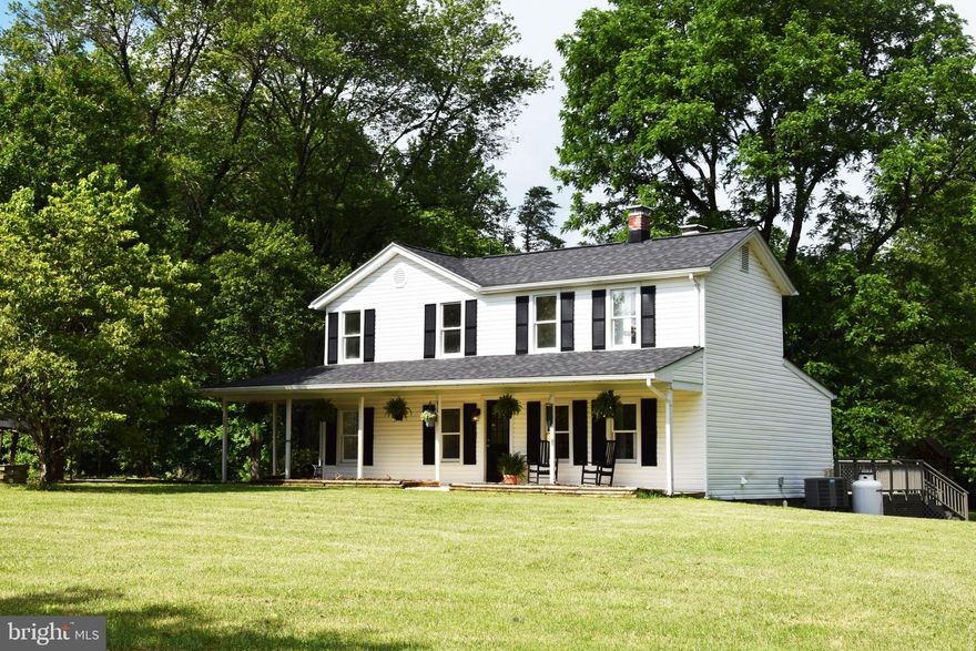 Come home to this one of a kind 1900's charmer!  This 3 bedroom 2 and a half bath updated farmhouse rests on a beautiful mostly open 3 acre lot.  The home has the most gorgeous original WIDE heart pine floors in the family room and 2 story entrance foyer.  The master bedroom suite is on the main level with 2 walk in closets and a newly remodeled master bath.  This kitchen is recently updated with painted cabinets and gorgeous quartz countertops!  Upstairs there are two more bedrooms and a large guest bath with room for another vanity!  The whole house exudes county charm!  It's been updated as well with a newer roof, HVAC, hot water heater, refrigerator and all fresh paint throughout!  Outside you'll find wonderful old trees scattered throughout the grassy yard and a nice wooded backdrop at the back of the lot.  There is a very large deck that's perfect for entertaining.  A chicken coop is ready for your backyard country companions.  There's also a shed for extra storage and a playset for the little ones.  (Chicken coop, metal run, and kids playset and trampoline can be removed upon request.)               Country roads take me home........