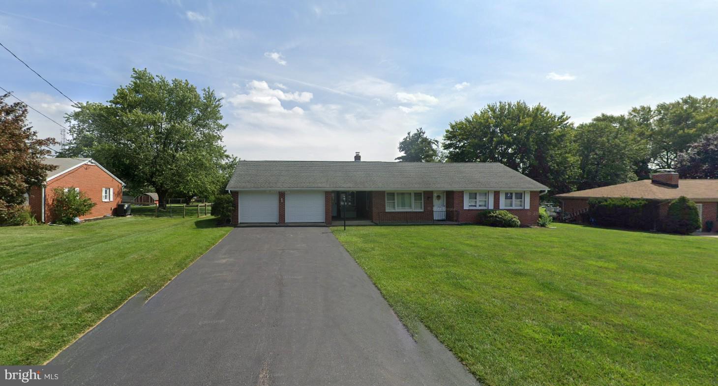 Welcome to this charming and well-maintained all-brick rancher which is located on the outskirts of Westminster, offering three bedrooms, two bathrooms, and nearly 1,500 square feet of main-level living space. The home sits on a beautifully level, nearly half-acre lot with a large deck, perfect for entertaining family and friends. Notable features include an oversized two-car garage, handicap accessibility, a Trane HVAC system with central air installed in 2023, and a heated sunroom that doubles as a main-level laundry room with access to the rear deck. Inside, you'll find original hardwood floors in good condition, a spacious living room, and a separate family room off the eat-in kitchen, which also includes a dedicated dining area. The mostly finished lower level provides additional living space, including a large entertainment area, storage, and a workroom area, with walkout stairs leading to the backyard. Other highlights include a large floored attic with built-in stairs and a paved extended driveway. Situated in a charming, well-kept neighborhood of single-family homes, this property is just a couple of miles from downtown Westminster, with easy access to I-795. The home is move-in ready but is being sold "as is" due to some peeling paint around a few interior windows and damage to the lower basement stairwell's exterior wall. Cash , renovation loan  or conventional offers  preferred.  The home is available for a quick settlement if desired. Don't miss this opportunity—schedule your showing today!