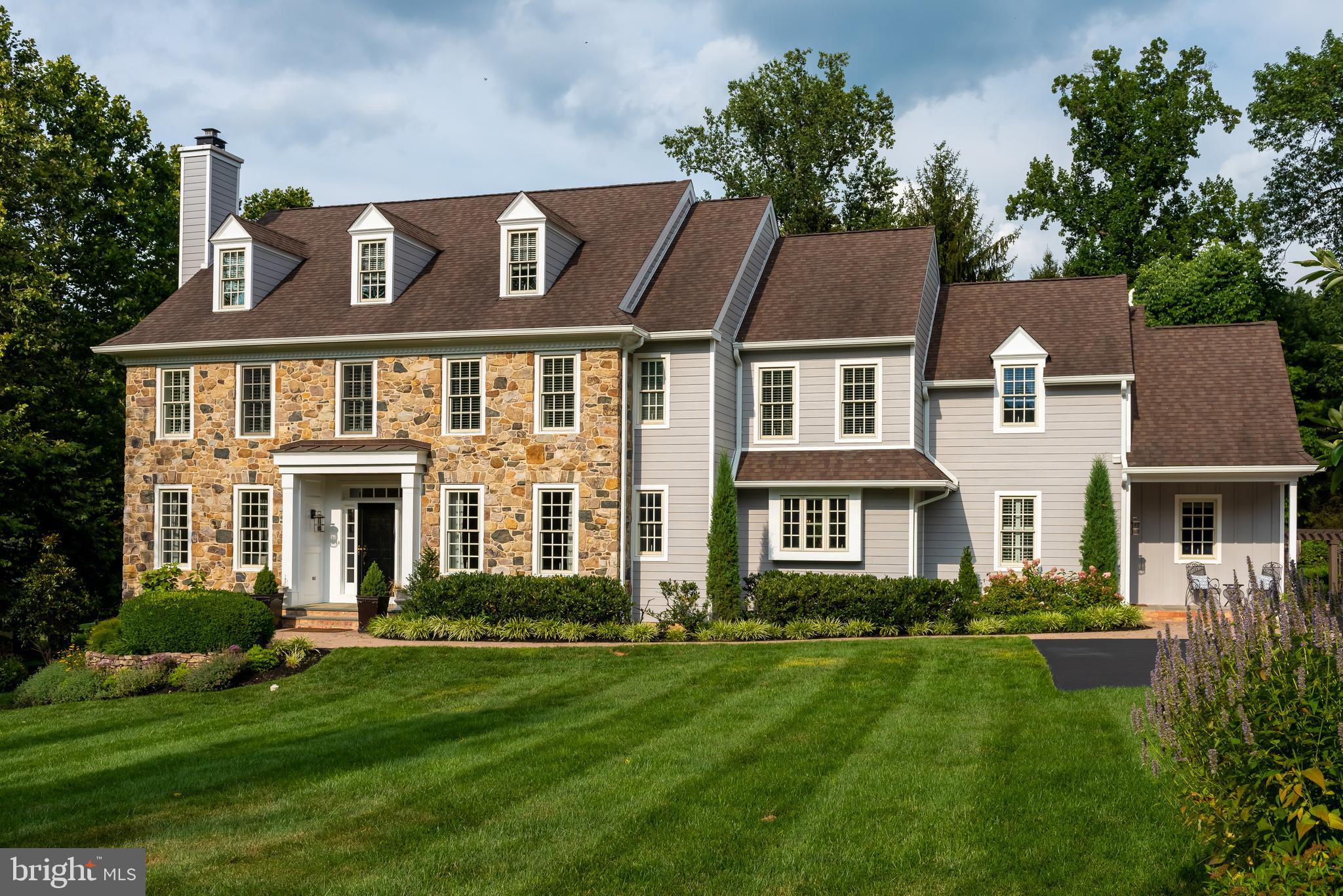 Welcome to 333 Contention Lane, a magnificent center hall Colonial offering three beautifully finished living levels in the heart of Berwyn and the top ranked Tredyffrin-Easttown School District.
An extremely well built home by master builder Ted Babiy. A full stucco removal and Hardie Plank installation was done in December of 2020. No need to deal with a messy remediation, it's already been done for you. This fabulous home provides serenity and privacy while also belonging to the Woodlea Community, offering the best of both worlds. Bordered by Contention, Margo and Bair Road, this voluntary neighborhood group organizes cocktail parties, community events and Holiday gatherings. Tucked away on a gorgeously planted lot and pleasant walk to the Berwyn Train Station, local pubs and restaurants. The screened porch, trex deck, outdoor kitchen and outdoor stone fireplace were custom designed and installed 2019-2021. The front to back entrance hall is flanked by a formal living room with a marble surround gas fireplace to the left and a classic formal dining room to the right. The gorgeous kitchen offers granite countertops, a multi-level center island with both tile and granite plus a vegetable sink, raised panel and display cabinetry, a tile backsplash, high end stainless steel appliances (Sub-Zero, Thermador and Kitchenaid) and a charming farmhouse sink. The dining area off the kitchen opens to the adjacent family room and offers a doorway to the screened in porch. A butler's pantry with granite counter, bar sink and display cabinets connects the kitchen and dining rooms. The terrific family room offers a wood burning fireplace with a cast iron insert, a cozy window seat and built-in cabinetry. The home office is the ideal setting for working at home or online learning. The tiled mudroom connects the home to the three car garage & features beadboard walls, a window seat & a doorway to the covered side porch. Gleaming hardwood floors, two powder rooms, chair railing and nine foot ceilings and much more complete the picture for the first floor of this very special home. A turned staircase with an Old World window seat leads to the second floor. The master suite with tray ceiling offers two walk-in closets and a dressing area along with a sumptuous master bathroom with handsome tile work, an oversized shower, a double sink vanity and a classic soaking tub. Two Jack and Jill bedrooms are connected by a full bathroom with a double sink. One of these bedrooms is currently configured as an upstairs den. The fourth bedroom has direct access to a full bathroom. The fifth bedroom features one walk-in closet leading to another plus access to unfinished eaves storage. The beautifully finished walkout basement offers full daylight windows, access to the multi-level patio and a powder room. A massive storage room can easily serve as a home gym and offers endless possibilities. The exterior features of the home are truly exceptional. A new screened-in porch features Trex flooring, a vaulted wood paneled ceiling, a very cool looking ceiling fan and a heater. The adjacent Trex deck overlooks the patio and fireplace and is highlighted by an outdoor kitchen with grill, storage cabinets and refrigerator. The large paver patio is centered by a magnificent stone fireplace. These features along with a spacious yard come together to create the ideal setting for outdoor relaxing, entertaining, grilling and dining al fresco. Relax after a hard day's work with a cool drink or start the day off right with a coffee as you look out over the beautiful grounds. A rear staircase, 2nd floor laundry room, LOW TAXES, glass transoms, beautiful window treatments and plantation shutters, ceiling fans, up to date paint colors throughout (2018), updated light fixtures, a holiday light package, tremendous closet and storage space plus quality detail work throughout all combine to make 333 Contention Lane an extraordinary investment and a wonderful place to call home.
