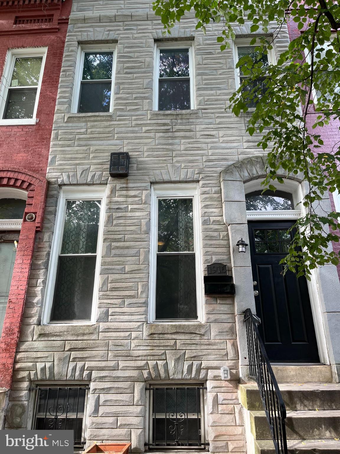 This great interior townhome is located in the Druid Heights area of Baltimore. The spacious open floor plan features hardwood floors, living room, dining room, updated cabinets, granite countertops, stainless steel appliances, and a .5 bath on the main level. The second level consists of a spracious primary bedroom with an en suite full bath, two additional bedrooms, and another full bath. The full finished basement has a fourth bedroom, full bath, living area, and Laundry area. The backyard is fenced in and equipped for a parking pad. The owner is motivated, and offers a 1% paint allowance with a full price offer.
