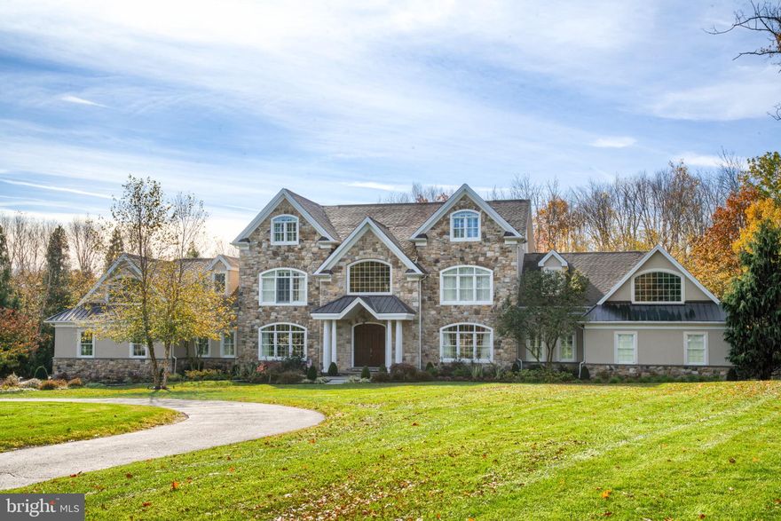 Come Discover Briarwood Court, located just outside of Historic Doylestown. This phenomenal custom-
built residence boasts richly appointed interiors, breathtaking pool, lush grounds, 4 car garage, elevator,
and 2 1/2 acres of untouched wooded back drop.  Enter this stunning home and you will notice the
architectural archways which create a seamless flow between casual and formal living spaces.  This
home is designed to accommodate the luxury lifestyle you deserve and the spur of the moment casual
gatherings that are inevitable.  The unique floor plan distinguishes this home from others, as it boasts a
first-floor private wing that features an all-inclusive Owners Suite. Complete with private patio, laundry
area, glorious sitting area and wet bar, luxurious master bath with walk in closet, fireplace, and private
access to lower-level gym. The elegance continues through the main level, presenting a bourbon lounge
with reclaimed wood accent wall, a well outfitted Butler’s pantry, and a smooth transition to the
dramatic two-story Family Room with floor to ceiling fieldstone fireplace. The warmth of this home is
felt in its stunning sparkling white kitchen with large, seated island and all the modern high-end details
that make entertaining and cooking pleasurable.  The second floor has 4 Bedrooms each with a full bath and walk in closets plus a central laundry area for ease and convenience. Continue to the Upper Level that is completely finished with flexible living space that can accommodate many needs...a private in-law, guest or Au pair suite.  Take the elevator down to the fully finished lower level where the focus is on entertainment. Home theater, seated bar, recreation/game room, meditation room and gym will provide hours of enjoyment.  Not to be outdone, equal attention was paid to designing the pool and tiered seating areas which rival a 5-Star resort. The centerpiece is the magnificent free form saltwater pool with organic
waterfalls, sun deck and a swim-up bar allowing  family and guests to bask in luxury.
 Elegance, Sophistication and Style await the discerning buyer.