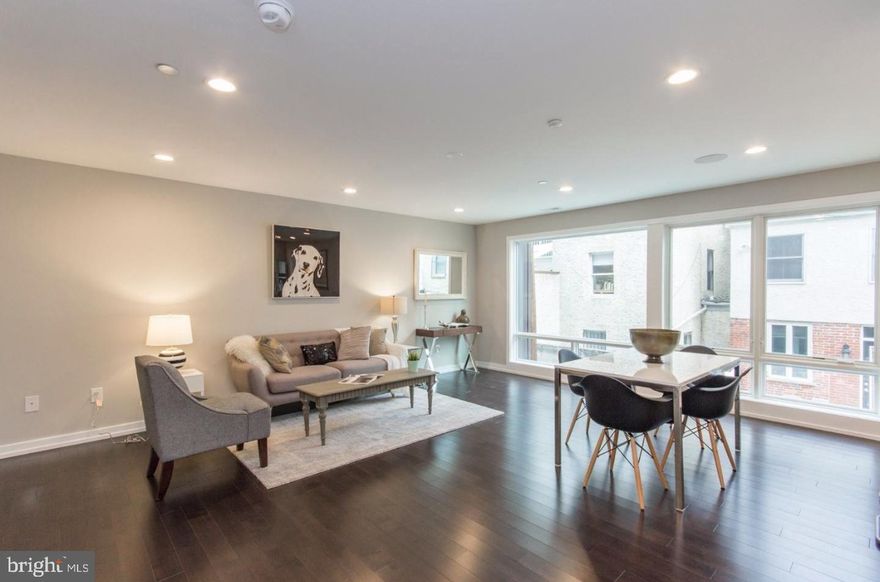 This stunning newer construction apartment in Bella Vista offers a luxurious space at a great value. This unit is one of 48 in the gated Garden Square development. With lavish butterfly gardens and a beautifully landscaped courtyard, this community is your Oasis in the heart of the city. Enter into your brand new home and immediately notice the natural lighting from the floor to ceiling front windows. Step across the fine hardwood flooring to your modern kitchen, featuring all brand new Samsung appliances, quartz counter tops and plenty of cabinet space. NEST Thermostats, speakers, shared roof deck and video intercom are just some of the many features of this condo. All bedrooms feature hardwood flooring, large closets and recessed lighting. The full bathrooms provide fantastic tile throughout, shower and vanity. Garden Square provides easy access to restaurants, shopping, schools, public transportation and much more. Close to I-76 and I-95 for an easy commute out of the city.