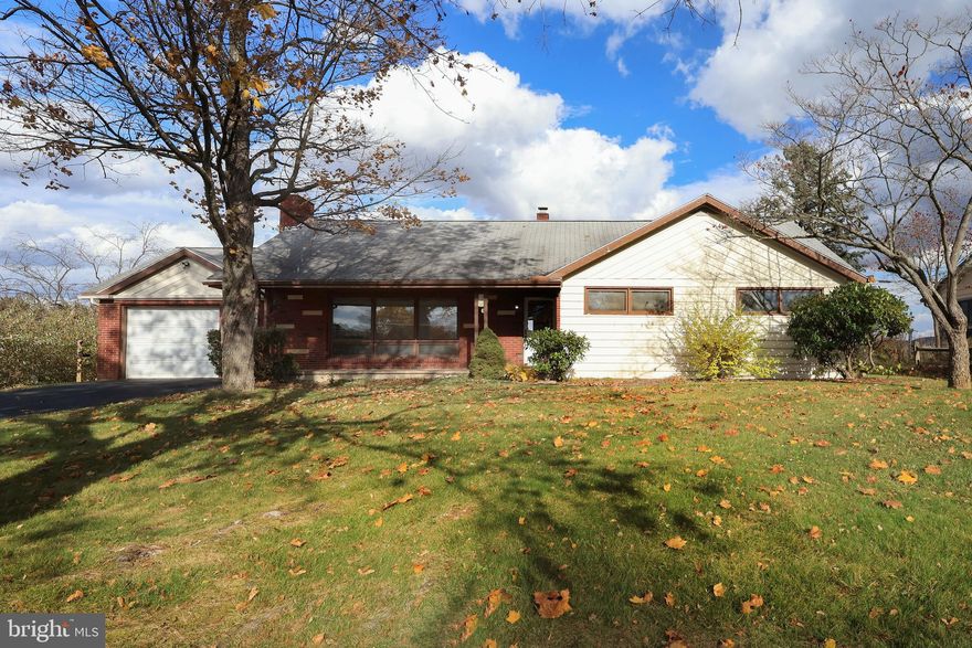 Tucked away on tree-lined Curtin Street in the desirable Overlook Heights neighborhood, this charming ranch offers a rare blend of serenity & convenience, backing directly to The Arboretum at Penn State with an unbelievable view of Beaver Stadium that’s pure Happy Valley magic. Just minutes from campus, shopping & beloved local eateries, it’s a hidden gem in the heart of State College.  Lovingly owned by the same family since 1977, this heartwarming home is ready to welcome its next chapter. Enjoy spacious one-level living with 4 bedrooms, 2 full baths, original ¾” oak hardwood floors throughout much of the main level, arched doorways & built-ins. A welcoming covered front porch leads into a light-filled living room featuring a large picture window & built-in shelves with a secret passage to the walk-up attic (yes, really!). The adjoining dining room is perfect for everyday meals or special occasions, while the fully equipped kitchen includes all appliances.  Down the hall, you’ll find three comfortable bedrooms, a full hall bath & a private primary suite with its own full bathroom. The partially finished basement offers a 48x12 rec room ideal for game day celebrations, a dedicated laundry room with a handy utility sink, washer & dryer included, a convenient laundry chute from the main level & ample unfinished storage space.  Additional highlights include oil hot water baseboard heat, a shed, and an attached 1-car garage. Step outside to a serene, flat backyard overlooking Penn State–owned land, offering peaceful views & a true sense of privacy. Just moments from Overlook Heights Park, Suburban Park, the Gerhold Wildflower Trail, Sunset Park & main campus, this location is a dream for Penn State enthusiasts & nature lovers alike.  The chimney for both fireplaces has been capped so they are not currently operable.  Property is being SOLD AS-IS.