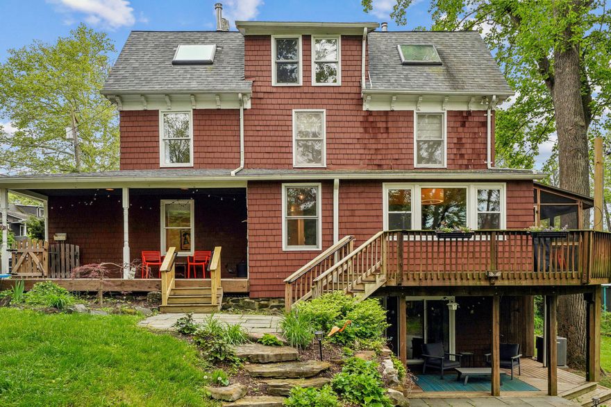 Tucked away on a quiet dead-end street, this charming and well maintained Mount Washington twin home offers the rare privacy of a lot adjoining open green space. With four bedrooms and two full bathrooms spread across 2,000 square feet of finished living space, the home is designed for both comfort and utility. 

The main floor features a cozy wood stove in the living room and a bright, open kitchen-dining area designed to frame the lush views and welcome guests. Upstairs, large skylights flood the top floor bedrooms with natural light, creating an airy, treehouse-like feel. The versatile, walk-out lower level includes a flexible finished space for a home office or guest suite, a dedicated workshop, a wine cellar, and laundry area.

Outdoor living is the heart of this property: choose between the covered front porch, the sun-drenched deck, the screened-in porch, or the shaded stone patio that leads directly into the yard.

From the warmth of the wood stove, to the terra cotta floors in the kitchen, and green views in every window, this home offers a peaceful, light-filled sanctuary in the heart of the community.