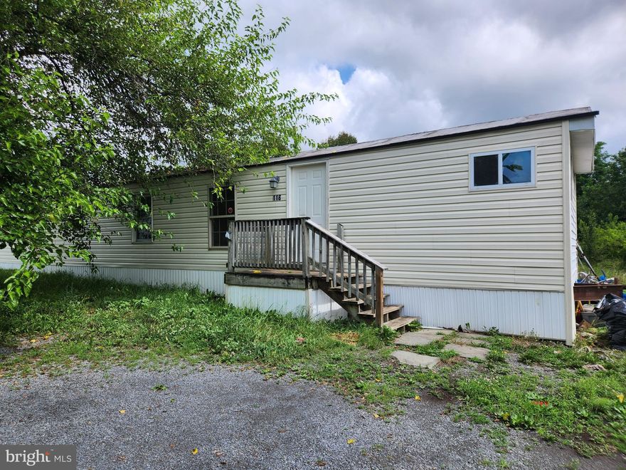 Nice trailer in Bunker Hill features 3 bedrooms, 1 bathroom, living room, kitchen, laundry hook ups, small yard with parking.  Close to VA line and I-81.  Pets allowed on case by case basis.