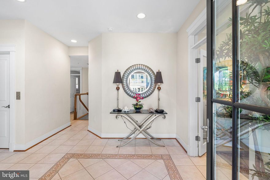 Custom-Built Bayfront Home in Sunset Island – Panoramic Views & Luxury Living in the Carolina style home, where the views are magnificent.

Welcome to 4 Beach Side Mews, a one-of-a-kind Bayfront single-family home located in the exclusive, gated community of Sunset Island. Everything about this 4-story coastal retreat speaks to custom design and thoughtful craftsmanship, from its expansive balconies to its stunning 180-degree views of the Assawoman Bay.

This home offers flexible living space across four levels, each designed for comfort, entertainment, and luxury. The ground level features a custom-finished garage with central vac, parking for four vehicles plus a golf cart, an outdoor shower, a den/home office, and a full bath—perfect for guests or a private workspace. A convenient elevator provides access to all levels.

The second floor includes a spacious owner’s suite and a guest bedroom, each with a private bath and walk in closets. The laundry room is also located on this level for added convenience.
The third floor is the heart of the home, offering some of the best views in Sunset Island. This level boasts a great room with a fireplace, a gourmet kitchen with high-end finishes and custom, built-in cabinetry, an oversized dining area, and a screened porch ideal for al fresco dining.  Front & rear decks on this level provide plenty of space for lounging and soaking in the breathtaking scenery.

The top level is a true showstopper: a second great room or loft-style entertainment space complete with a built-in bar, full bath with walk-in shower, and access to a sun deck offering panoramic views of the Assawoman Bay. Whether you're entertaining guests or enjoying quiet evenings at home, this space is an unforgettable highlight of the property.

But the greatest feature of all? The views. With 10-foot-wide southerly exposed decks on multiple levels, this home was designed to capture every sunrise, sunset, and sparkling water view that Sunset Island has to offer.

Community amenities include indoor and outdoor pools, three private Bayfront beaches, a fitness center with sauna, a clubhouse, on-site restaurant, fishing/crabbing pier, jogging paths, beautiful landscaping, and a staffed security gate.

This is more than a home—it’s a lifestyle. Whether you're seeking a year-round residence or a luxury coastal retreat, 4 Beach Side Mews offers a unique opportunity to own a truly special property in one of Ocean City’s most desirable waterfront communities.