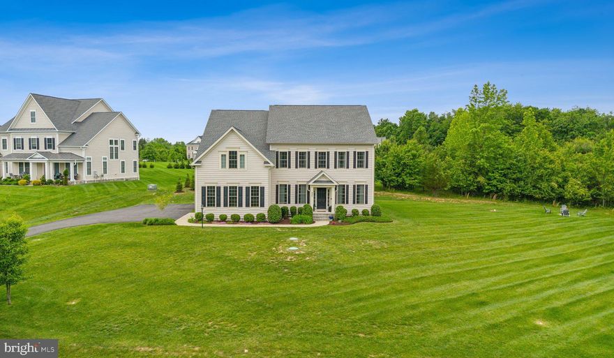 Welcome to Laytonsville Grove! Nestled on a premium 1.83+ acre lot in a prestigious enclave of luxury homes by Lennar Homes, 237 Barberry Lane is the stately residence that checks every box — and then some. From the moment you arrive, this stunning 6,000 square foot property will take your breath away.

Inside, you’ll find soaring ceilings, gleaming hardwood floors, custom lighting, and built-ins throughout. The main level offers a gracious foyer, a spacious home office with custom French doors and recessed lighting, and a formal dining room that connects to a beautifully appointed butler’s pantry. This space includes a wet bar and a custom walk-in pantry with closed cabinetry and floor-to-ceiling shelving.

The gourmet kitchen is an entertainer’s dream, featuring an oversized center island, gas cooktop, granite countertops, and an abundance of cabinetry. The cozy breakfast area flows seamlessly onto the covered back porch through a sliding glass door — the perfect spot for morning coffee or evening relaxation.

The great room boasts cathedral ceilings, gas fireplace, custom built-ins, and large windows that flood the space with natural light. A powder room is thoughtfully positioned off the family room. A versatile main-level bedroom with a full en suite bath offers the flexibility to serve as a guest suite, den, or second office. The mudroom off the sizable two-car garage includes a built-in bench and hooks for easy organization.  An EV charger also conveys with the home! 

Upstairs, you’ll find four additional bedrooms and a well-appointed laundry room. The expansive primary suite offers ample space for a private sitting area or retreat. Its spa-like bathroom features a soaking tub, enclosed shower, dual vanities, and TWO walk-in closets sure to impress any fashion lover. A second bedroom includes its own en suite bath, while two additional bedrooms share a third full bathroom. The laundry room adds convenience with built-in cabinets, a countertop, and a utility sink.

The finished lower level is perfect for entertaining, with a spacious recreation area and a custom bar complete with a built-in beverage refrigerator. It also features a sixth bedroom and full bath — ideal for guests, a home gym, or additional living space — plus two large unfinished storage areas.

Outside, this professionally landscaped and hardscaped property was designed for both entertaining and relaxing. The patio has multiple seating areas for outdoor gatherings.

From the impressive curb appeal to the thoughtful interior details, this home has it all. Just minutes from Laytons Village Shopping Center — home to local favorites like The Family Room and Juliano’s Brick Oven Pizza, Montgomery Country Club, and multiple golf courses — as well as everyday essentials like a post office, nail salon, and barber. You’re also a short drive to Olney, Lone Oak Brewery, and more.

Don’t miss the opportunity to make this exceptional home your own!