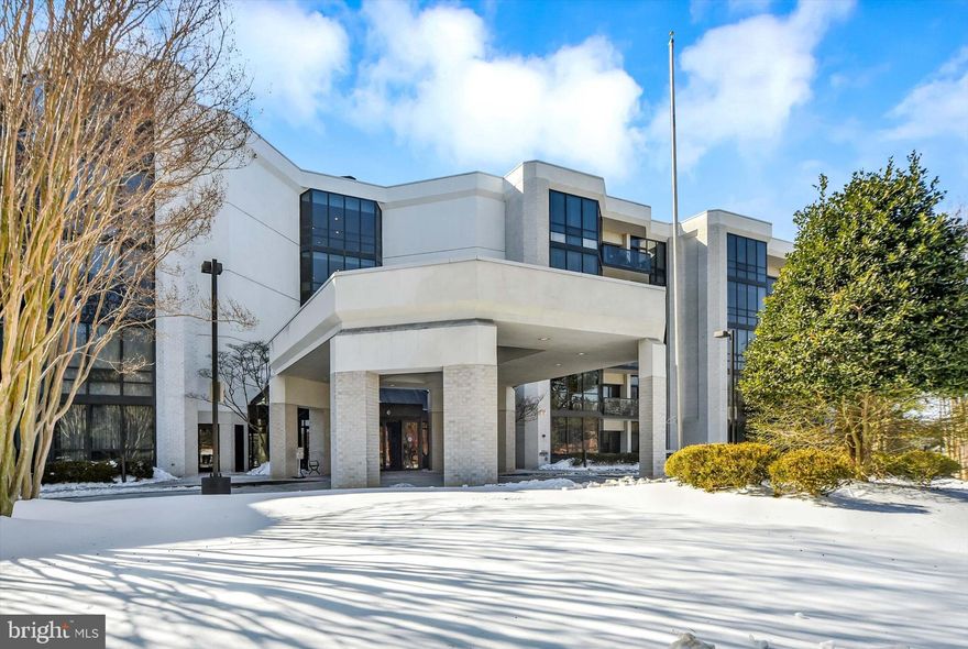 Spacious luxury condominium in the sought-after Pavilion in the Park. This expansive residence offers approximately 2,600 square feet of thoughtfully designed living space, completely renovated in 2019 with high-end finishes throughout. The open living and dining areas feature hardwood floors, abundant natural light, and effortless flow for entertaining, with direct access to a large private patio. Just off the living area, there is a den with custom built-ins provides ideal flexible space for a home office, library, or additional sitting area.

The chef’s kitchen includes custom cabinetry, a massive island, induction cook top, quartz countertops, premium appliances, generous storage, and a breakfast area. The primary suite is a true retreat with patio access, an oversized walk-in closet, and a spa-inspired bath. A second bedroom with its own walk-in closet is complemented by multiple additional bathrooms, offering flexibility for guests.  The dedicated laundry room, has ample storage and front loading machines at waist height for maximum convenience.
This full-service building offers 24-hour concierge, fitness center, indoor, library, party rooms, and beautifully maintained grounds. One garage parking space conveys. Ideally located near shopping, dining, and major commuter routes, this home delivers turnkey luxury with exceptional amenities.