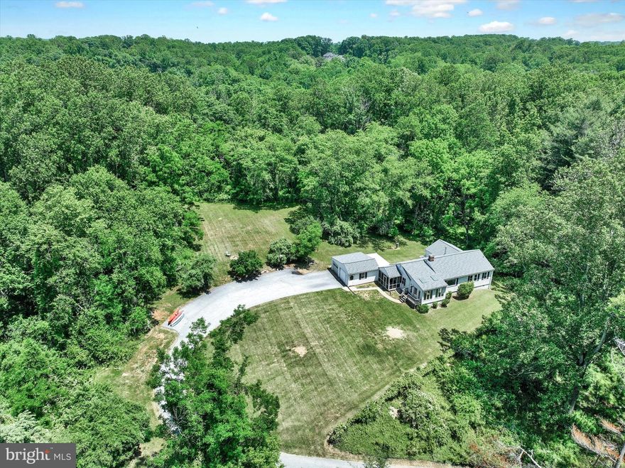 LONG, ACCESSIBLE GUNPOWDER RIVER FRONTAGE with well-groomed trail for both river access and hiking. This is a rare opportunity to purchase a beautiful 27-acre parcel of land in a fantastic location! All kinds of wildlife and birds, trails through the woods, abundant peace and quiet, and some of the best trout fishing on the East Coast. And this area of the river is below Monkton so it's still quiet and serene. Current owners have used the property as a weekend get-away, and the modest ranch-style home is perfect for that. Or bring your architect along to help you reimagine the existing house or perhaps to imagine building your dream home in its place. So many possibilities for this one-of-a-kind property! The home sits high with winter views of the river to the south and wooded river frontage on the north and east. Most of the land is wooded and gently slopes down to the river. The cleared area surrounding the house is private and level with plenty of space for lawn, outdoor amenities, and even a small stable if you like. The loop trail is not steep and offers easy walking or ATV access for fishing, kayaking, and tubing or just spending the day in your hammock reading a book while the river flows by. And it's only a short walk up Corbett Road to the NCR Hike & Bike Trail that connects Hunt Valley to York, PA. What a perfect spot for the buyer who loves outdoor recreation. Easy access to I-83 for commuting and only 15 minutes to Hunt Valley Town Center with stores, movies, and restaurants. Enjoy all the North County has to offer including wineries, breweries, local eateries, a gallery nearby, and let's not forget the highly rated Hereford schools!