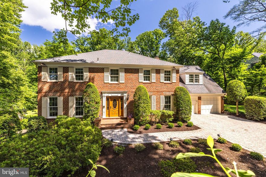 With a picturesque and private setting on over an acre, this traditional brick colonial offers fresh paint throughout its light-filled three levels with a versatile floor plan and over 6,000 SF of living space, along with a spectacular backyard with a pool, spa and extensive hardscaping. The main level features a foyer, formal dining room and a large living room with a fireplace. The eat-in kitchen offers a large center island, a breakfast area, access to the backyard deck and opens to the expansive family room, with skylights and a fireplace, overlooking the gorgeous backyard. Upstairs, the primary suite provides a dressing area with two walk-in closets and an updated primary bath with dual vanities, a seamless glass shower with a bench, a jetted tub and direct access to the bedroom-level laundry room. There is an additional bedroom suite and two additional bedrooms that share a hall bath. The walkout lower level offers a large recreation room and a wet bar, game area and billiards area that leads to a cherry-paneled study with a fireplace, a built-in desk and French doors leading to the backyard. There is also an exercise room, full bath and large storage/utility room. The parklike backyard features a pool and spa surrounded by a beautiful bluestone patio and lush, perennial plantings. There is a wraparound deck off of the main level, patios, a shed and a large lawn off of the side of the house. Generac backup generator. Close to Tysons and only a short drive to Reston, Arlington and Washington.