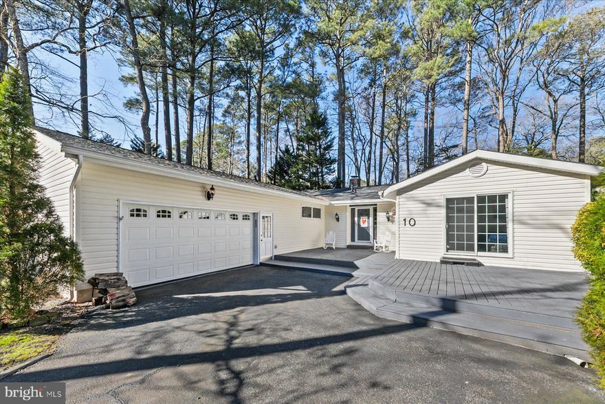 Where comfort meets coastal living—welcome home to one-level perfection in the heart of Ocean Pines.
Tucked away on a quiet cul-de-sac and set on an exceptionally large .445-acre lot—rare for the community—this beautifully maintained ranch-style home offers effortless living, thoughtful upgrades, and spaces designed for gathering, relaxing, and truly enjoying every season.

Step inside to a living room that instantly captivates vaulted ceilings with exposed wood beams soar above a striking stone-surround, wood-burning fireplace, creating a warm and inviting centerpiece for cozy winter nights or relaxed evenings with friends.

The open kitchen and dining area is an entertainer’s dream, featuring quartz countertops, newer soft-close cabinetry, bamboo flooring, and abundant storage. A built-in buffet with matching quartz makes hosting seamless—perfect for holiday spreads, casual brunches, or evenings spent sharing meals and memories.

Just beyond, a large screened-in porch with sliding glass doors extends your living space outdoors—ideal for morning coffee, summer dinners, or unwinding after a day at the beach.

The home offers three bedrooms, two and a half baths, plus a flexible bonus room with a brand-new skylight, accessible through the garage—perfect as a home office, game room, guest retreat, or creative hideaway. A 1½-car garage with a workbench adds functionality, while the oversized front deck and generous driveway provide plenty of space to enjoy the outdoors.

Major updates deliver peace of mind, including a brand-new roof on both the home and shed (2025 – $22,000) with a transferable warranty, a tankless hot water heater (2014), and efficient one-zone heating and air conditioning.

Life in Ocean Pines
Living here means access to one of the most comprehensive amenity offerings on Maryland’s Eastern Shore, blending coastal leisure, recreation, and social life.

⛵ Ocean Pines Yacht Club & Marina
A waterfront hub featuring a marina, two seasonal pools, live entertainment, and a full restaurant and bar—the perfect spot for sunset cocktails, summer music, and community gatherings.

🏊 Swim & Racquet Club
Enjoy a large outdoor pool complex with a kayak launch area, ideal for paddling the St. Martin River and soaking in the natural surroundings.

🎾 The Racquet Center
One of the region’s premier racquet facilities, offering:
10 tennis courts (8 composition, 2 hard surface)
6 platform/SPEC tennis courts
12 dedicated pickleball courts
Full-service Pro Shop, leagues, clinics, and social play for all skill levels

⛳ Ocean Pines Golf Club
Home to the only Robert Trent Jones, Sr. championship golf course on Maryland’s Eastern Shore, this public course offers memberships for individuals and families. The professionally staffed facility includes:
Expansive clubhouse with dining
Full-service Golf Shop
Sheltered driving range
Practice chipping, pitching, and putting greens
Practice bunkers and modern learning center
Clinics, private lessons, club repair, bag storage, and tournament hosting

🏖️ Ocean Pines Beach Club – 49th Street, Ocean City
Your private coastal escape just minutes away. The Beach Club spans the entire ocean-side block between 49th and 50th Streets and features:
Large oceanfront swimming pool with lounge seating
Full-service restaurant, bar, and snack counter
Live entertainment and volleyball courts
Direct beach access with umbrella and chair rentals
Locker rooms, showers, and beach wheelchairs
Permit-only private parking (beach-side and bay-side lots)
Upper-level event space for dining, weddings, and private parties
From boating and golf to beach days and live music, Ocean Pines offers a true lifestyle—one that feels like vacation every day.

📞 Schedule your private showing and experience this home—and this community—for yourself.