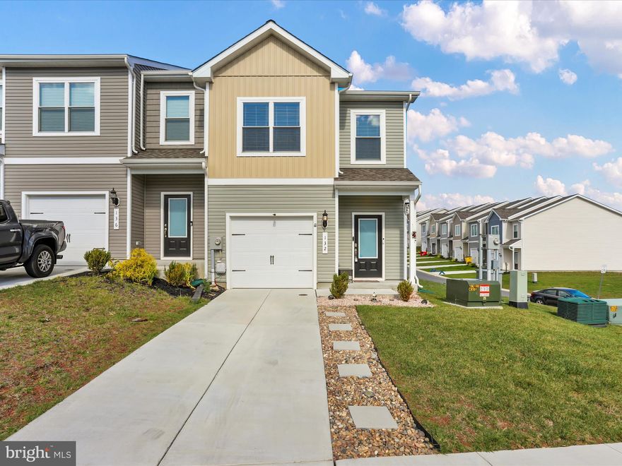 Modern comfort meets small-town charm in Falling Waters!

If you've been searching for a home that checks all the boxes, this is it!  This end-unit 3 bedroom, 2.5 bath townhome is only two years young and shines with stylish, modern finishes throughout.  You'll love the open-concept main level with luxury vinyl plank flooring, a bright kitchen with stainless steel appliances and a seamless flow to your massive outdoor space.  Step outside to the massive 16x16 deck and beautifully-designed patio area that's completely low-maintenance.  Gardening, grilling, relaxing by the fire pit and hosting unforgettable get-togethers make this outdoor space a dream!  Upstairs, you'll find laundry on the bedroom level, plus two comfortable additional bedrooms that share a full bath.  The primary suite feels like a true retreat-complete with a spacious walk-in closet, dual sink vanity, separate shower and your soaking tub.  Nestled in a friendly community just minutes from I-81, the Potomac River and the Maryland line, this home makes commuting a breeze and weekends even better.  If you love an outdoor space built for entertaining, don't wait....schedule your tour today!