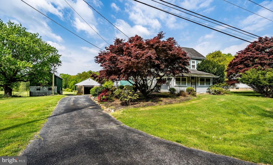 Discover a rare opportunity with this exceptional 13.49-acre estate featuring two distinct single-family homes! Motivated seller eager to sell! 
Imagine the possibilities for a multi-generational family compound or explore the diverse potential offered by its Suburban zoning, which accommodates residential development, agricultural pursuits, religious institutions, recreational facilities, and more!
Currently a private family sanctuary, the property boasts a spacious 2,400 sq ft ranch-style home with 3 bedrooms, two baths, and a walkout basement, alongside a charming 1,700 sq ft colonial farmhouse offering 3 bedrooms and one bathroom. Both residences are serviced by public water and private sewer. Multiple barns and outbuildings, once part of a working farm, provide ample storage or exciting opportunities for repurposing.
The expansive land is a true asset – mostly level and open, with several acres of mature trees at the rear, fostering a haven for wildlife and enhancing the natural beauty. Envision cultivating your own gardens and enjoying the space! 
Adding to the appeal, natural gas utility service has recently been installed on Frazer Road and is readily available for connection. Located within the highly sought-after Appoquinimink school district and offering convenient access to US Route 40 and I-95, this property presents a unique blend of lifestyle, investment, and development potential. Schedule your showing today to fully appreciate the remarkable possibilities awaiting you!